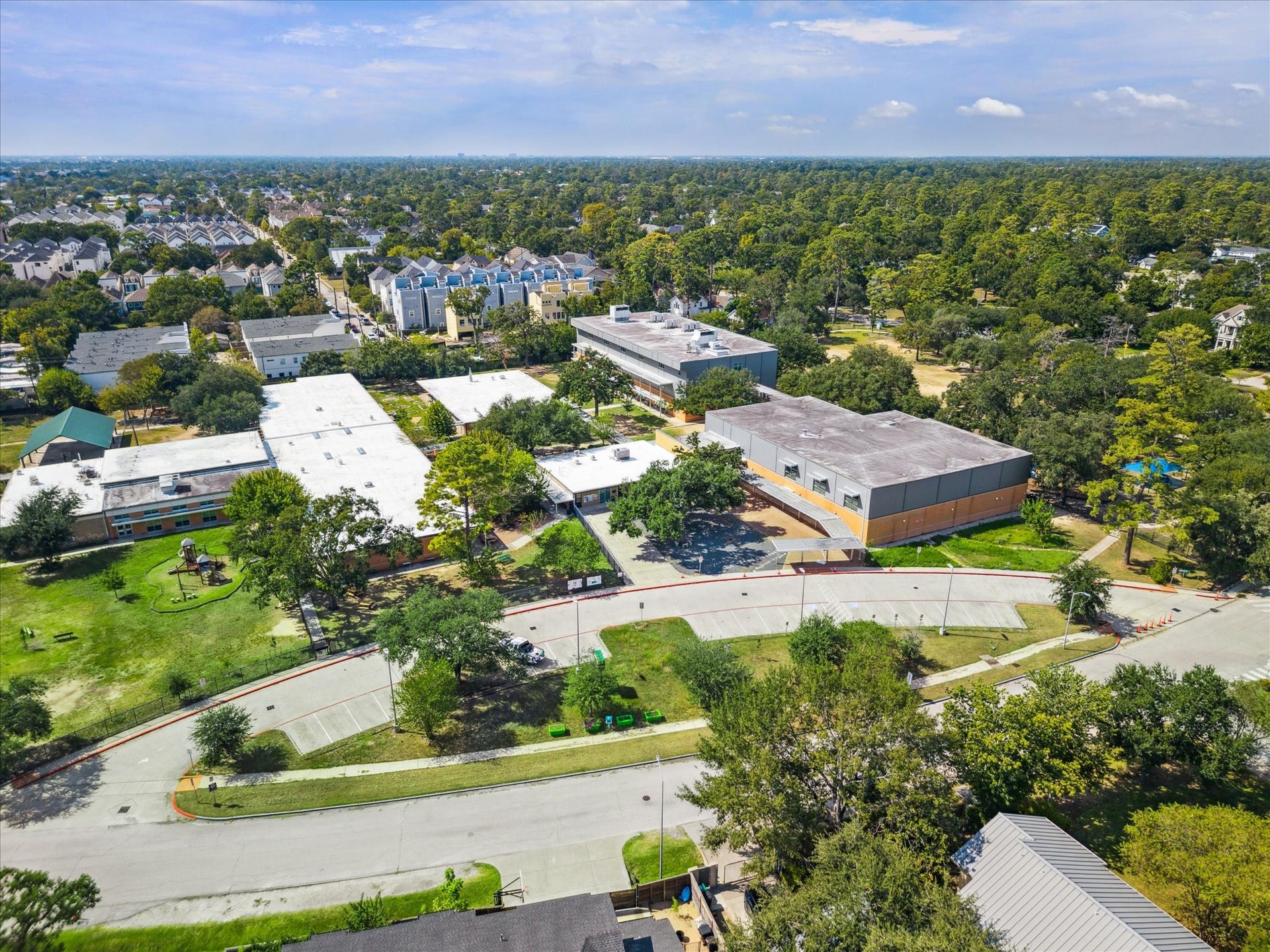 Located in the heart of the Garden Oaks neighborhood, Garden Oaks Montessori is not only a standout educational institution but also a hub for outdoor community engagement. The campus is surrounded by a beautifully maintained green park space featuring mature oak and pine trees that provide natural shade and a serene environment for students and residents alike.