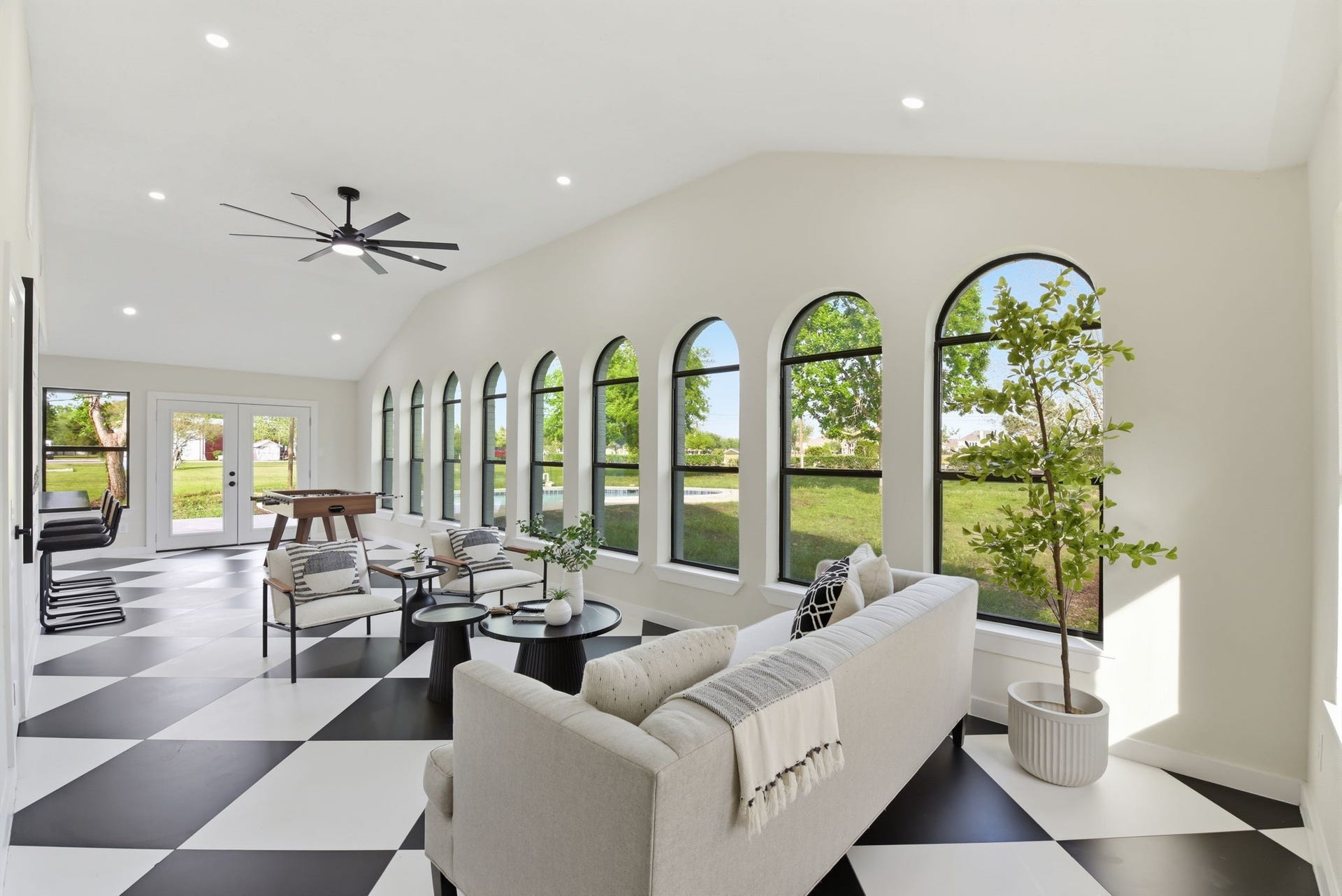 1011 Sycamore Road, Richmond, TX 77469 Semi moon lit custom windows in the great room illuminate the space