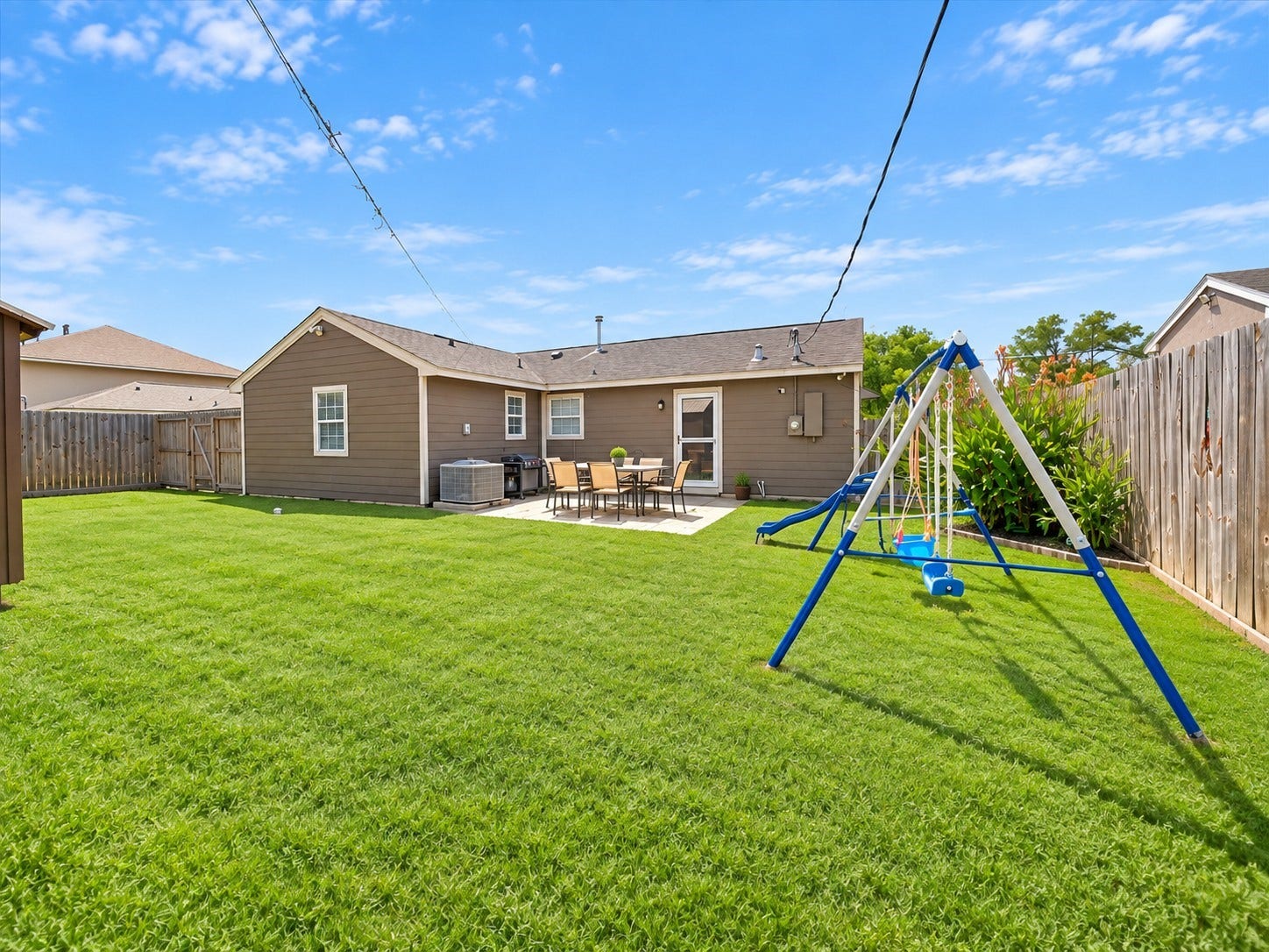 Step outside to a fully fenced backyard built for entertaining, complete with a covered patio, room for a play set, and endless possibilities for outdoor fun.
