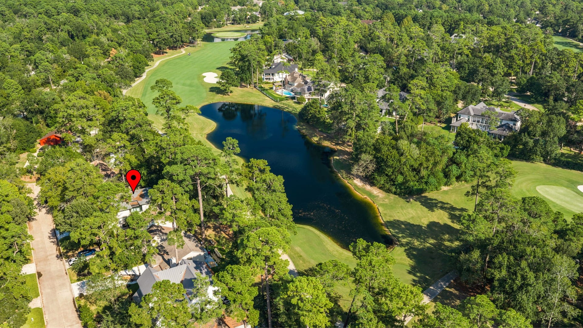12 N Timber Top Dr, Spring, TX 77380 Prime golf and water views! Perfectly positioned with direct vistas of the course and a quiet pond.
