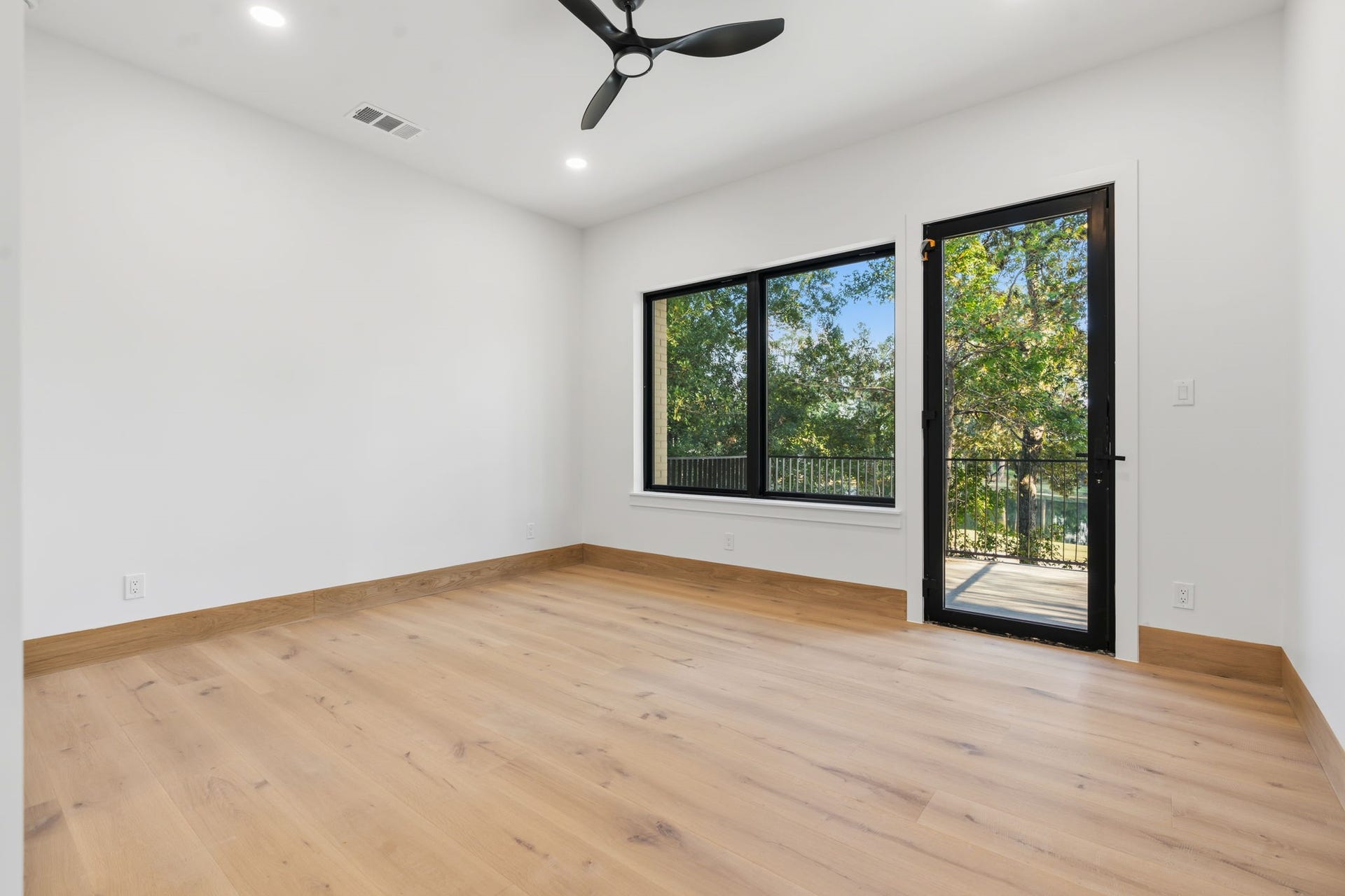 12 N Timber Top Dr, Spring, TX 77380 Spacious primary bedroom featuring a private balcony with stunning views