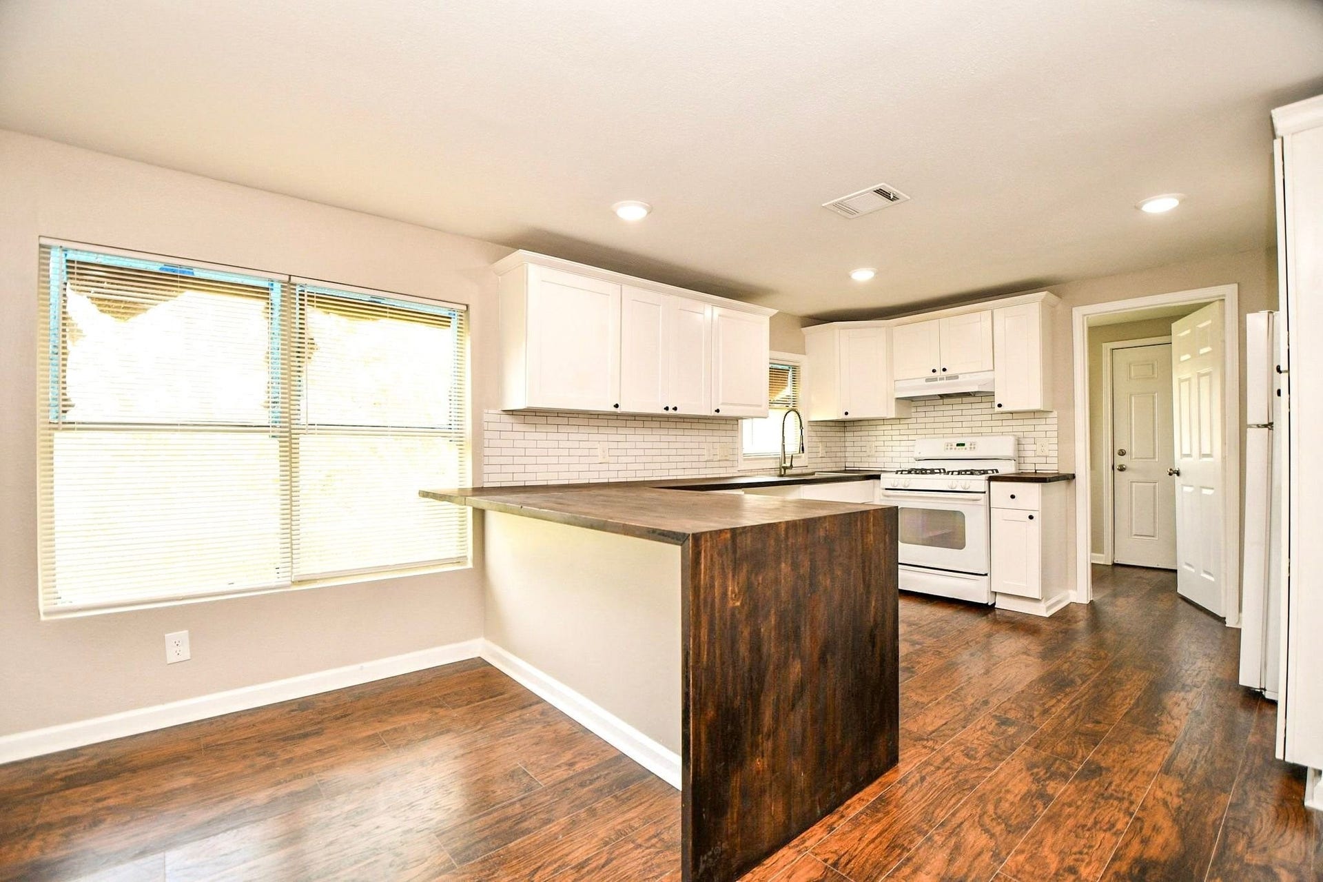 3642 Easy Street, Houston, TX 77026 Kitchen with a spacious breakfast bar and ample cabinetry for all your cooking and storage needs.