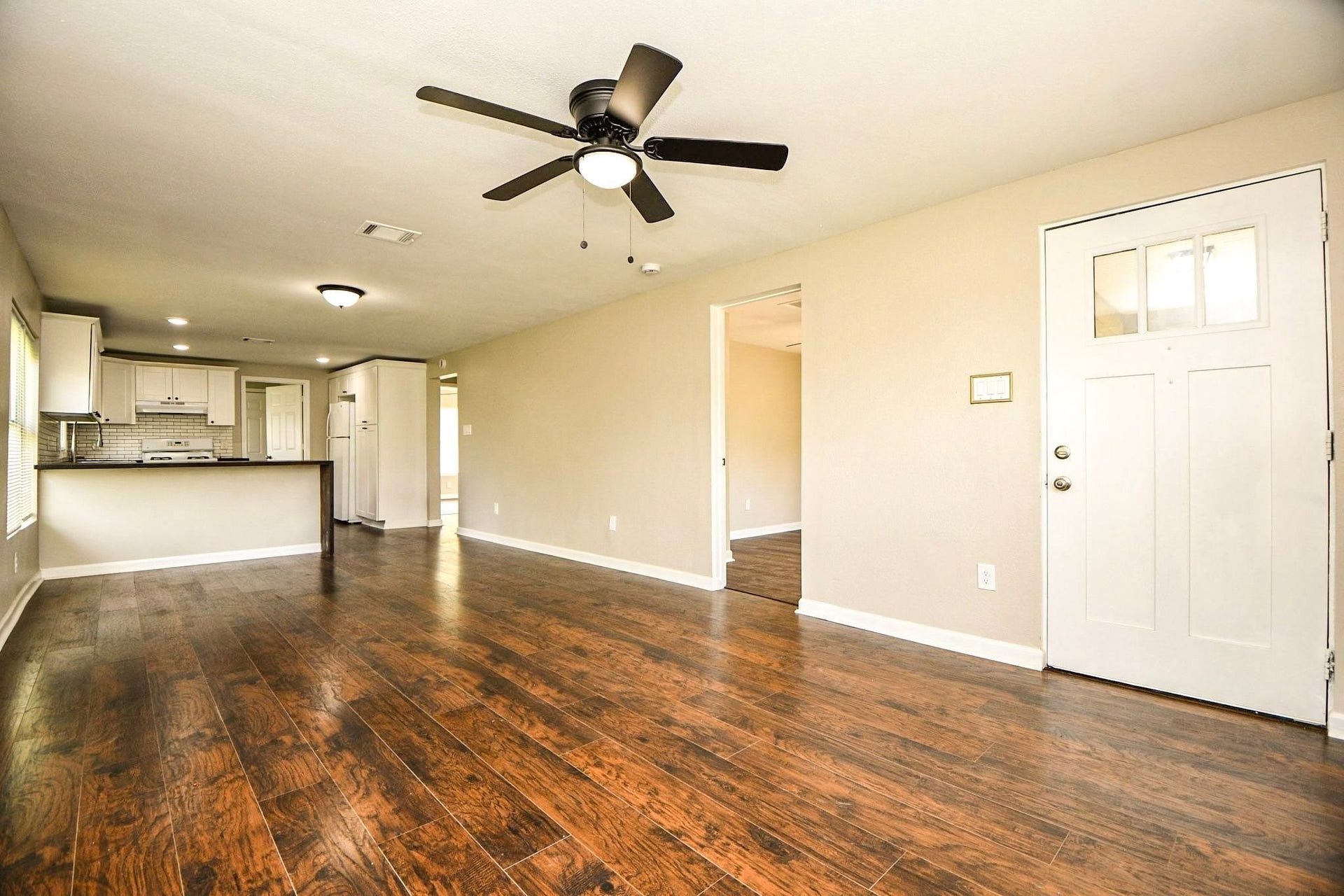 3642 Easy Street, Houston, TX 77026 Living area with a ceiling fan and an open layout leading straight to the kitchen.