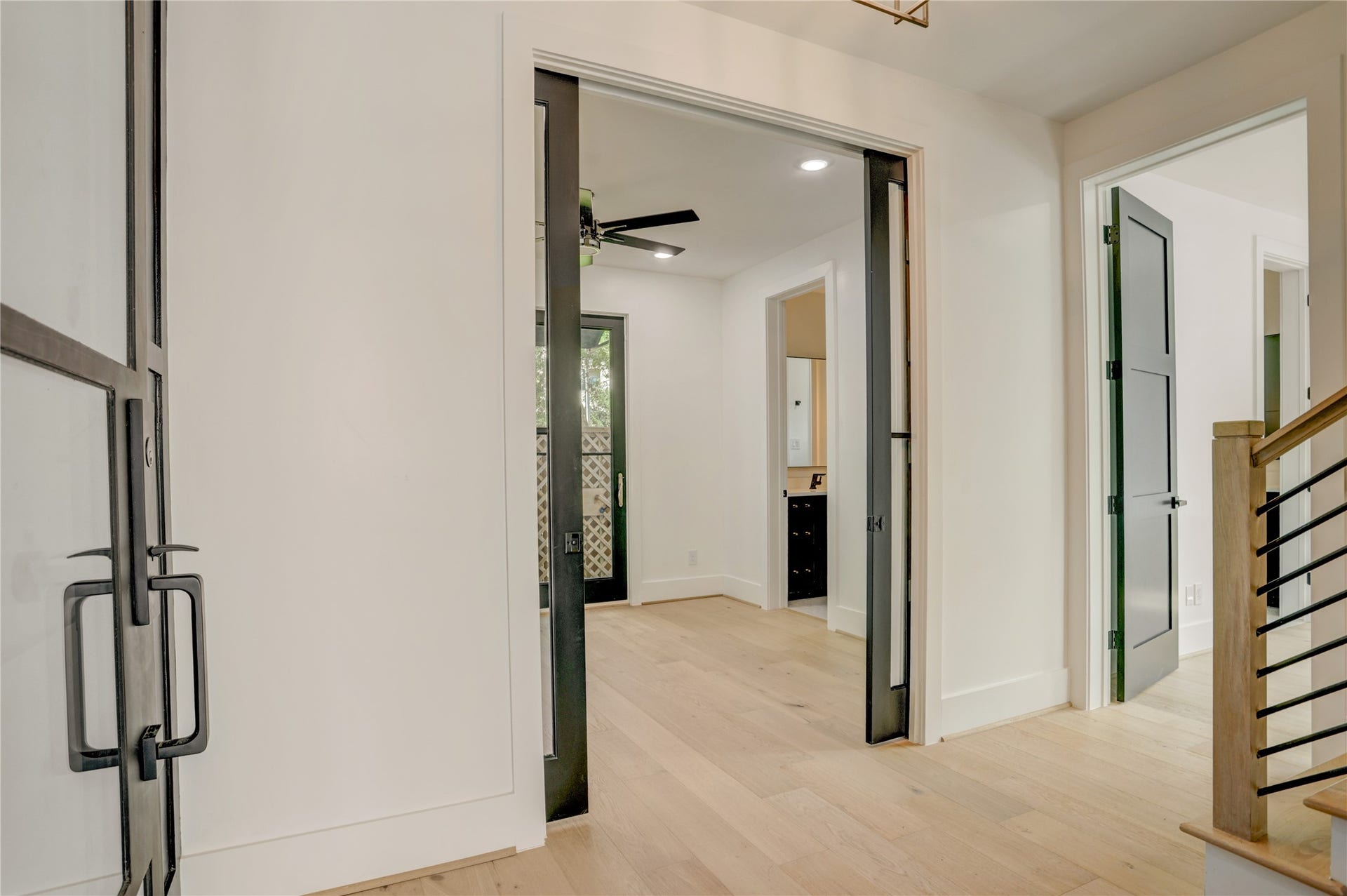 1907 Lauderdale Street, Houston, TX 77030 View as you enter the home, showcasing the glass French door study/bedroom 4 and access to the first floor suite.