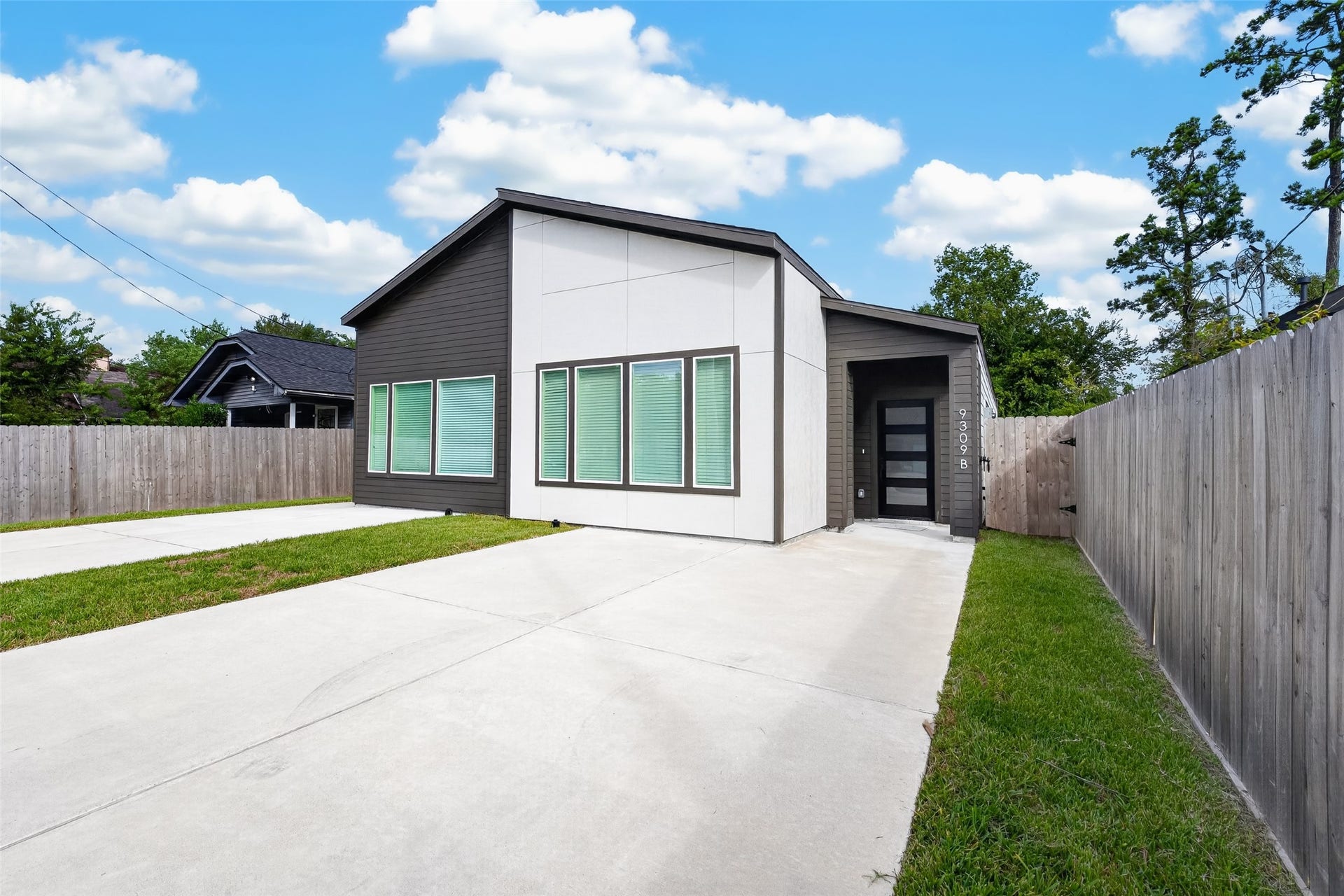 9309 Caddo Road, #A/B, Houston, TX 77078 Welcome to Unit B! Showcasing a sleek, eye-catching architectural facade with high-contrast paneling, this side of the home offers its own private entrance and wide drivewaygiving you all the space, style, and independence of a standalone home.