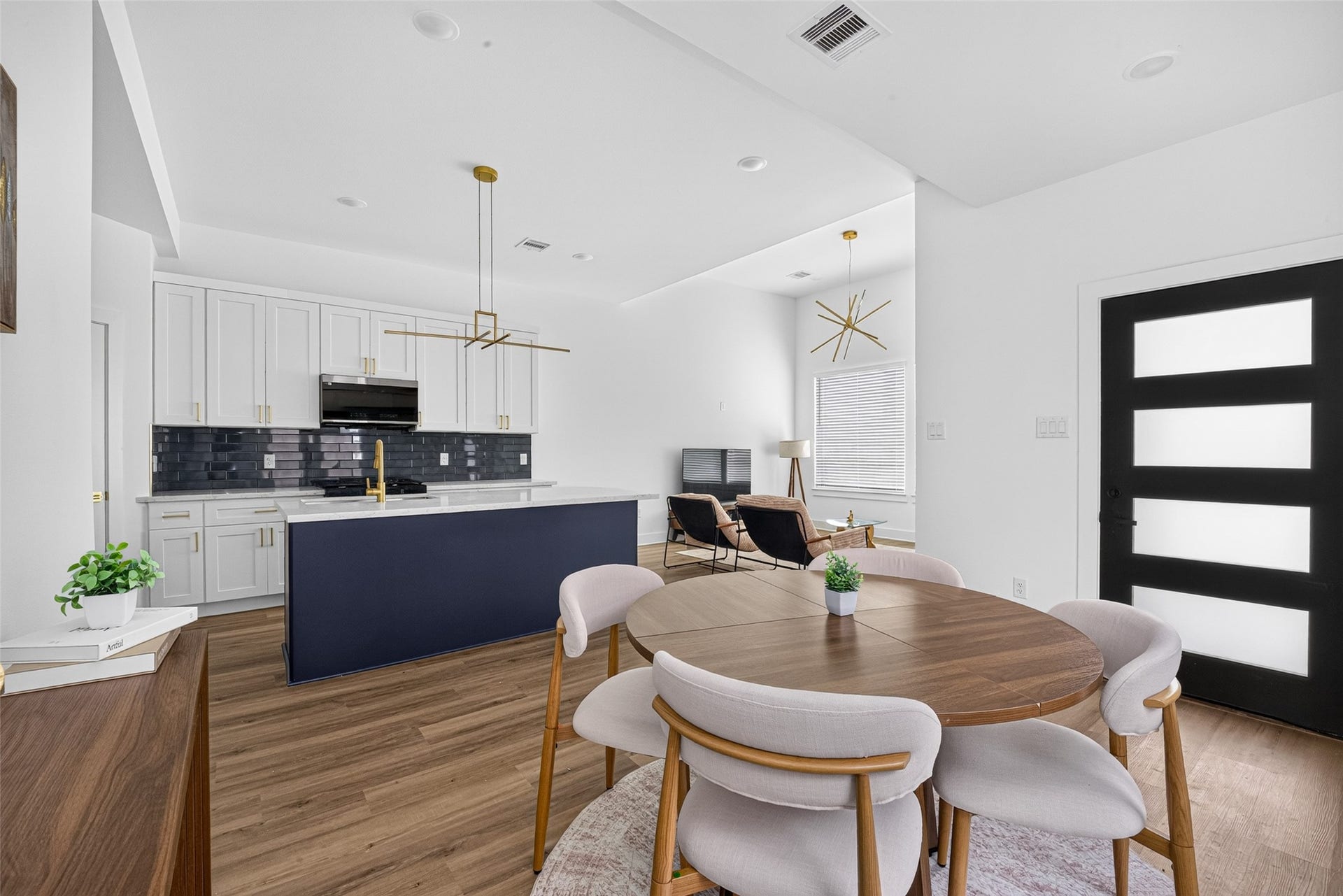 9309 Caddo Road, #A/B, Houston, TX 77078 Designed for modern living and effortless entertaining, this open-concept main floor seamlessly connects your kitchen, dining, and living spaces into one bright, cohesive retreat.