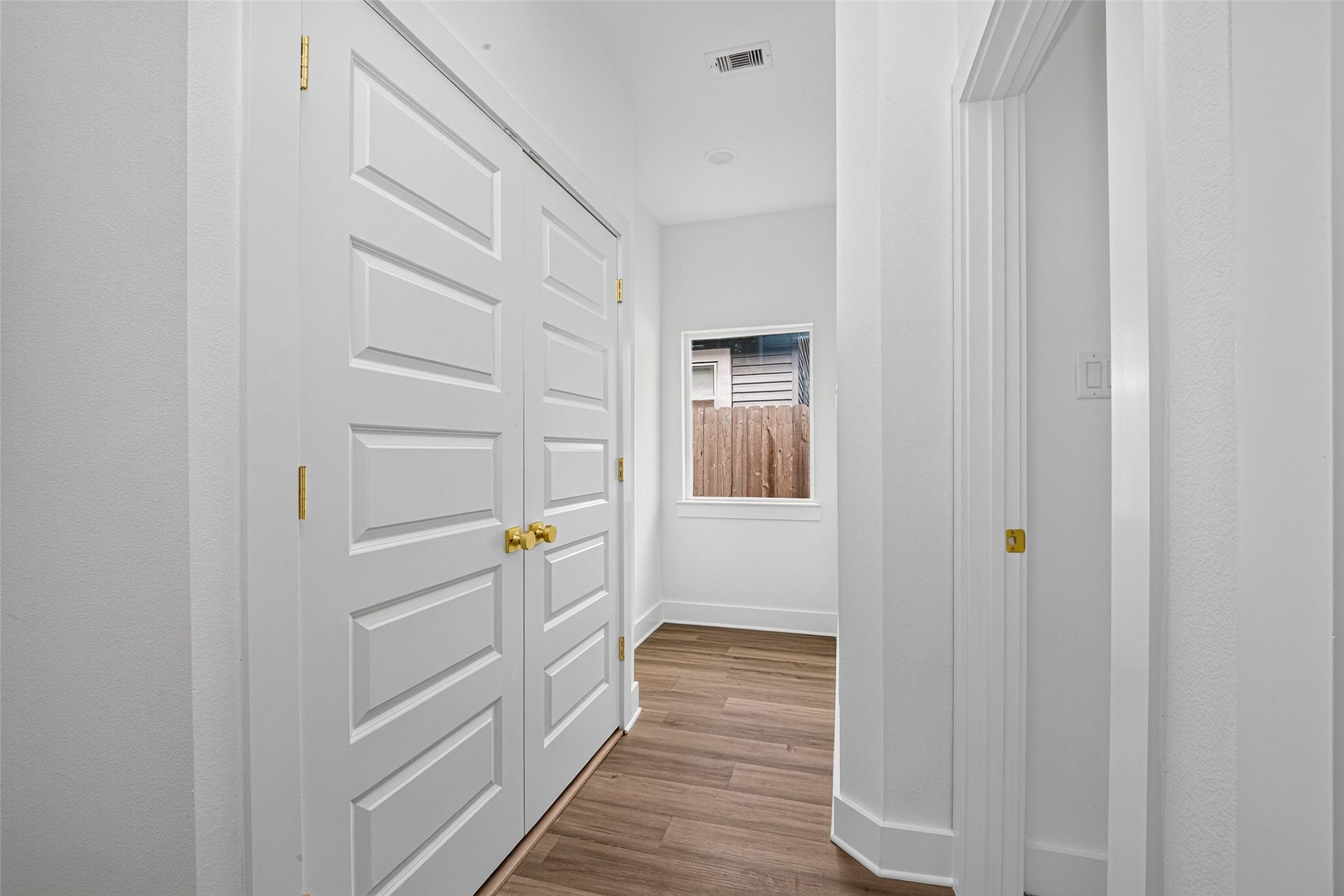 9309 Caddo Road, #A/B, Houston, TX 77078 Elegant double doors and glowing wood-look flooring set a sophisticated tone as you navigate through the light-filled main level.