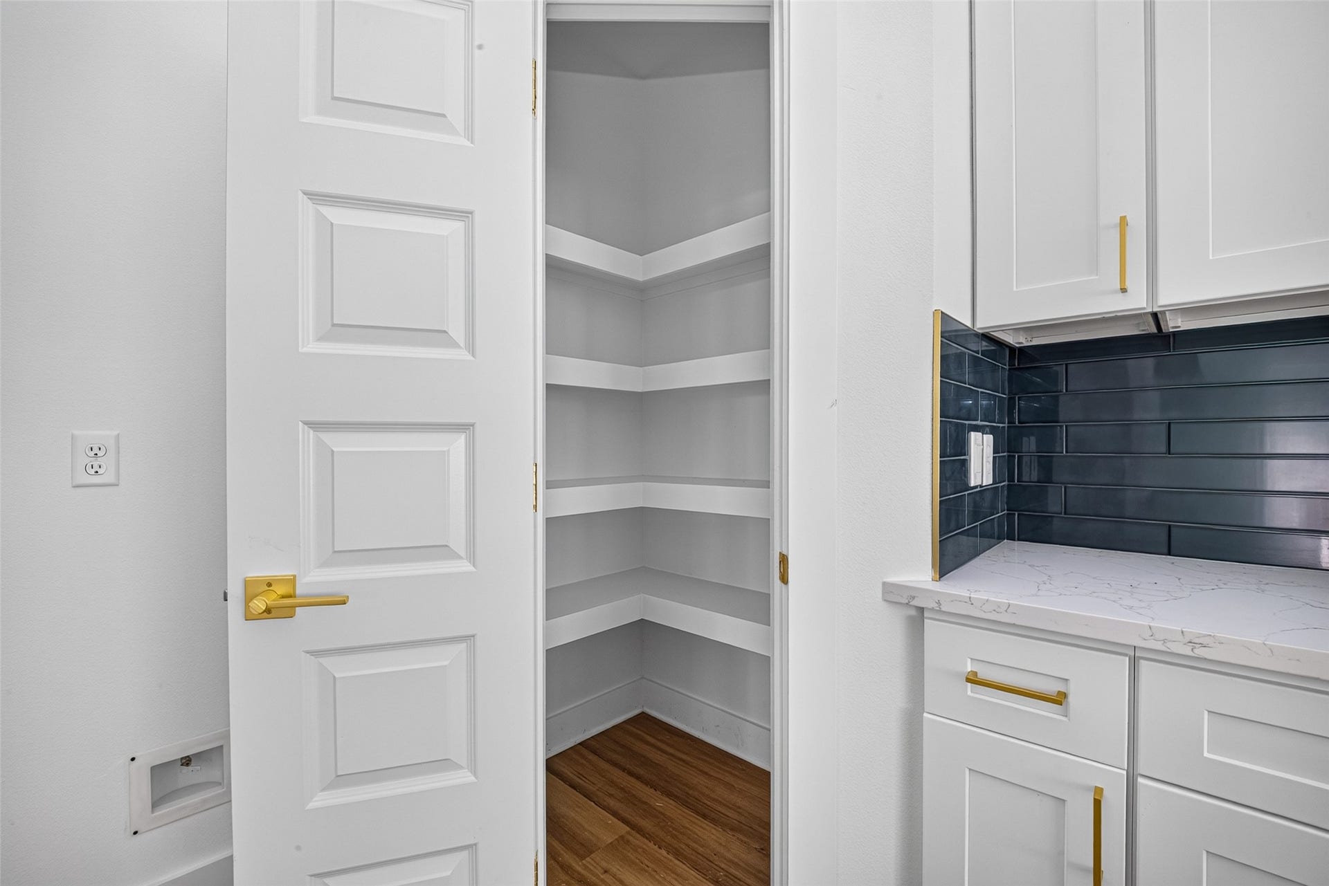 9309 Caddo Road, #A/B, Houston, TX 77078 Conveniently situated right off the gourmet kitchen, this walk-in pantry offers custom shelving to keep all your cooking essentials within arm's reach.