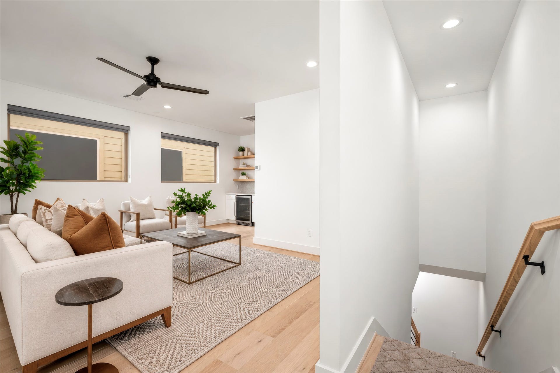 2410 Elmen Street, Houston, TX 77019 Third floor gameroom with engineered wood floors, two large windows filling the room with natural light, ceiling fan, dry bar with storage and shelves has potential for many different uses. Mother-in-law suite, media room gym? Virtually rendered.
