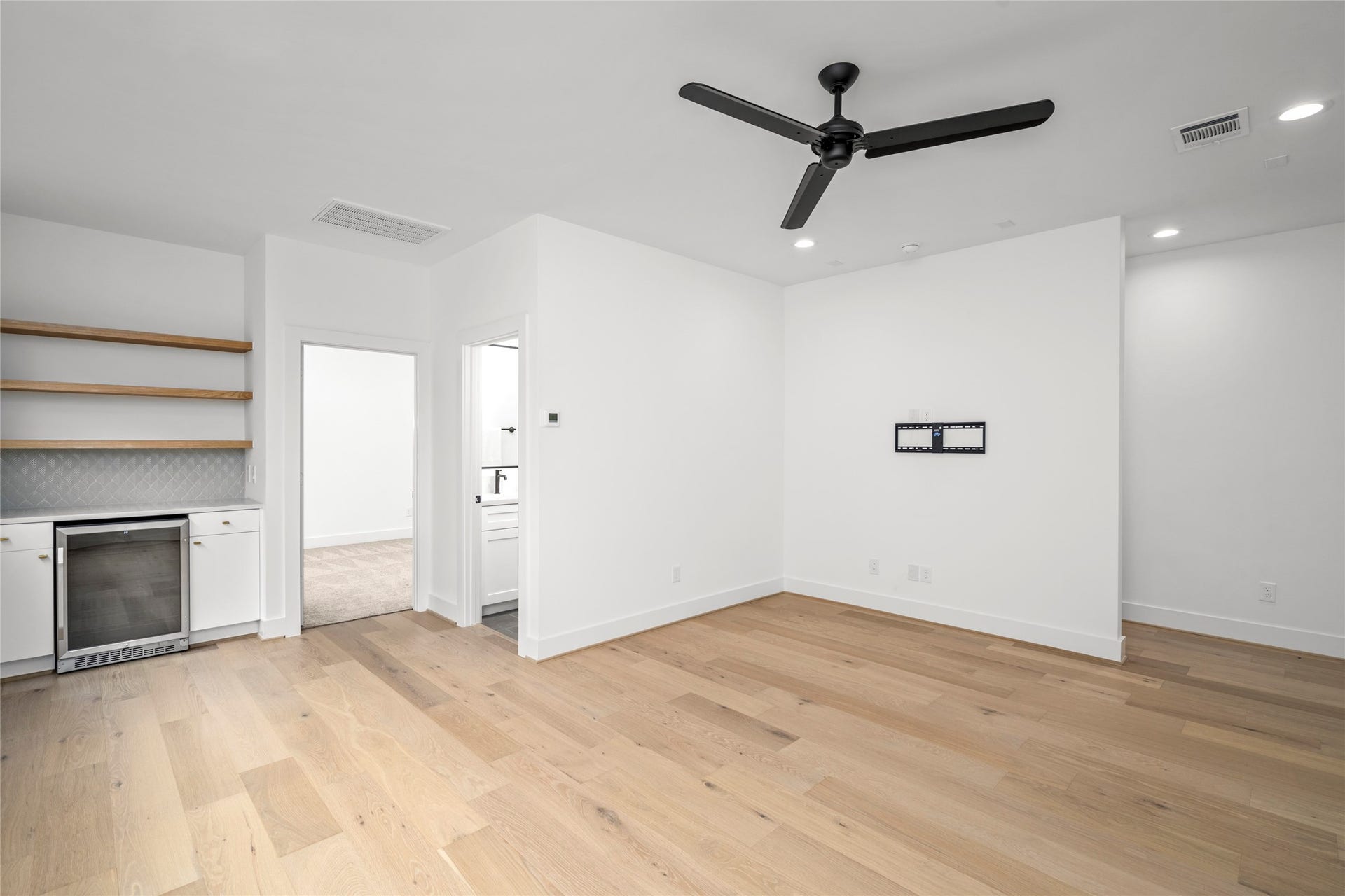 2410 Elmen Street, Houston, TX 77019 Gameroom view with the dry bar, bedroom and bathroom.