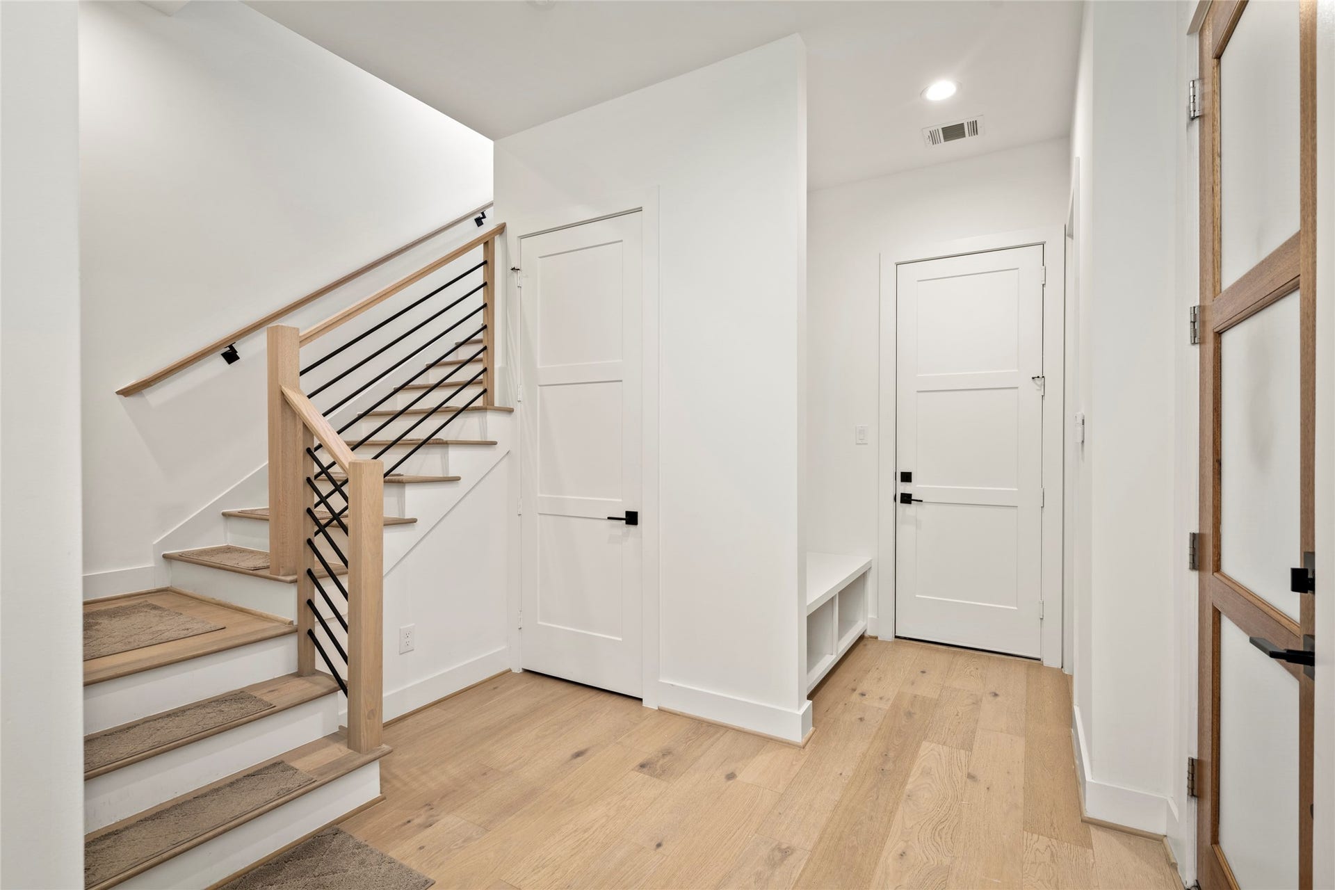 2410 Elmen Street, Houston, TX 77019 Spacious foyer as you enter the home. Huge closet for storage under the stairs. Mud area to the right with storage. Door leads to the garage. Half bath/Powder Room tucked away from the living areas.
