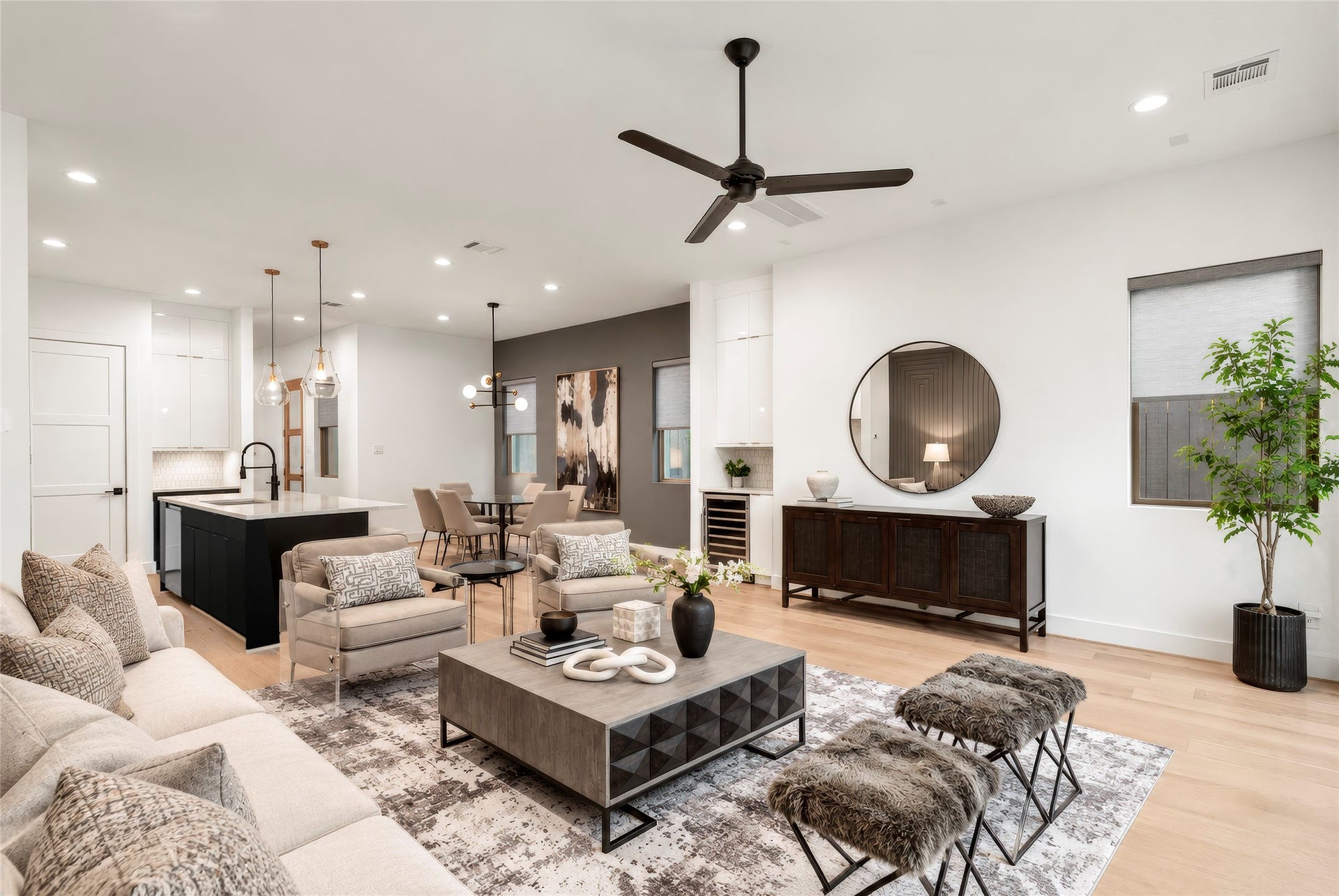 2410 Elmen Street, Houston, TX 77019 Gorgeous living room has plenty of room for furnishings. Such flexible entertaining with living room, dining room and kitchen together in this transitional space. Virtually rendered.