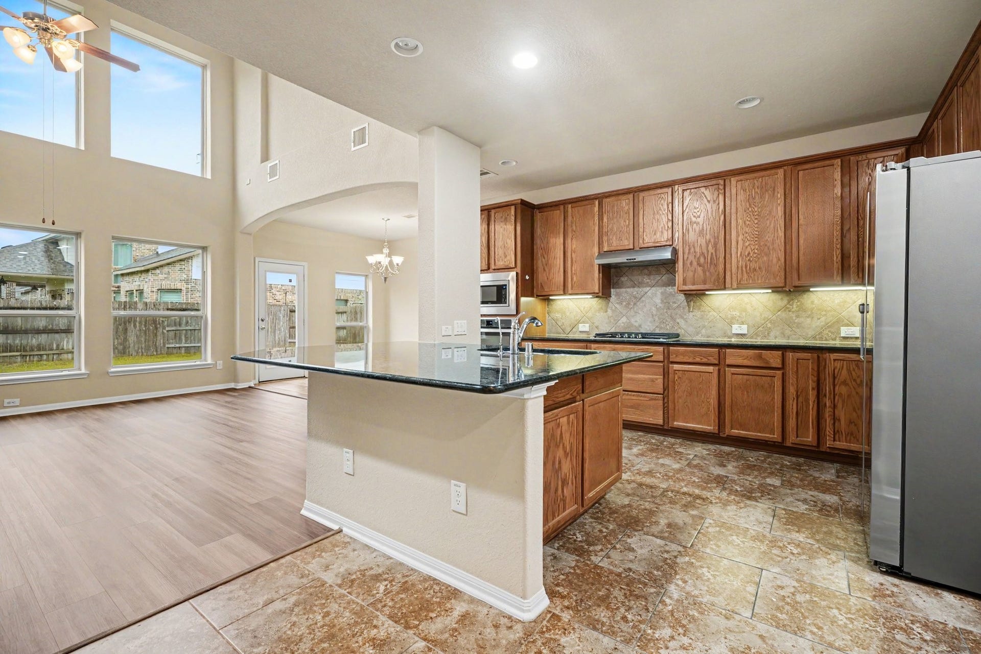 A large island with breakfast bar offers additional seating for entertaining, or quick meals before heading out for the day!