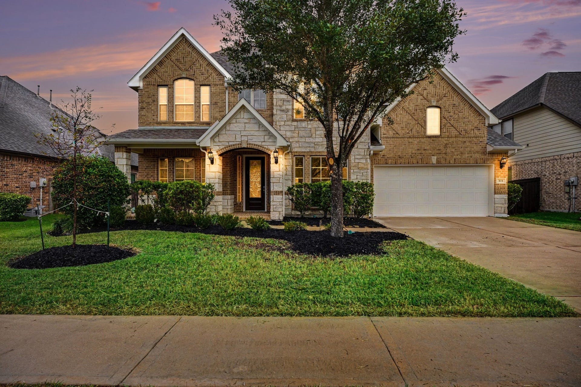 This home exudes warmth as the day turns to dusk!