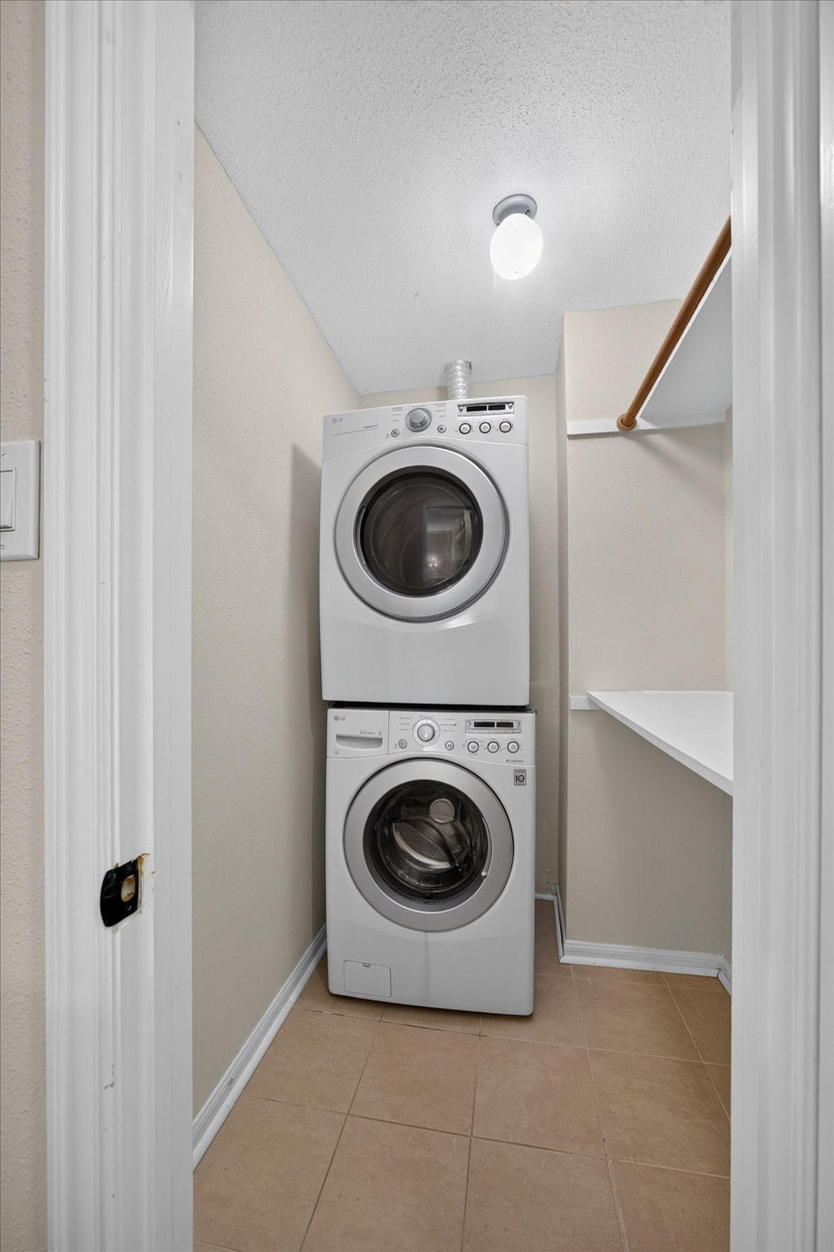 Laundry room upstairs. Washer and dryer convey with the home.