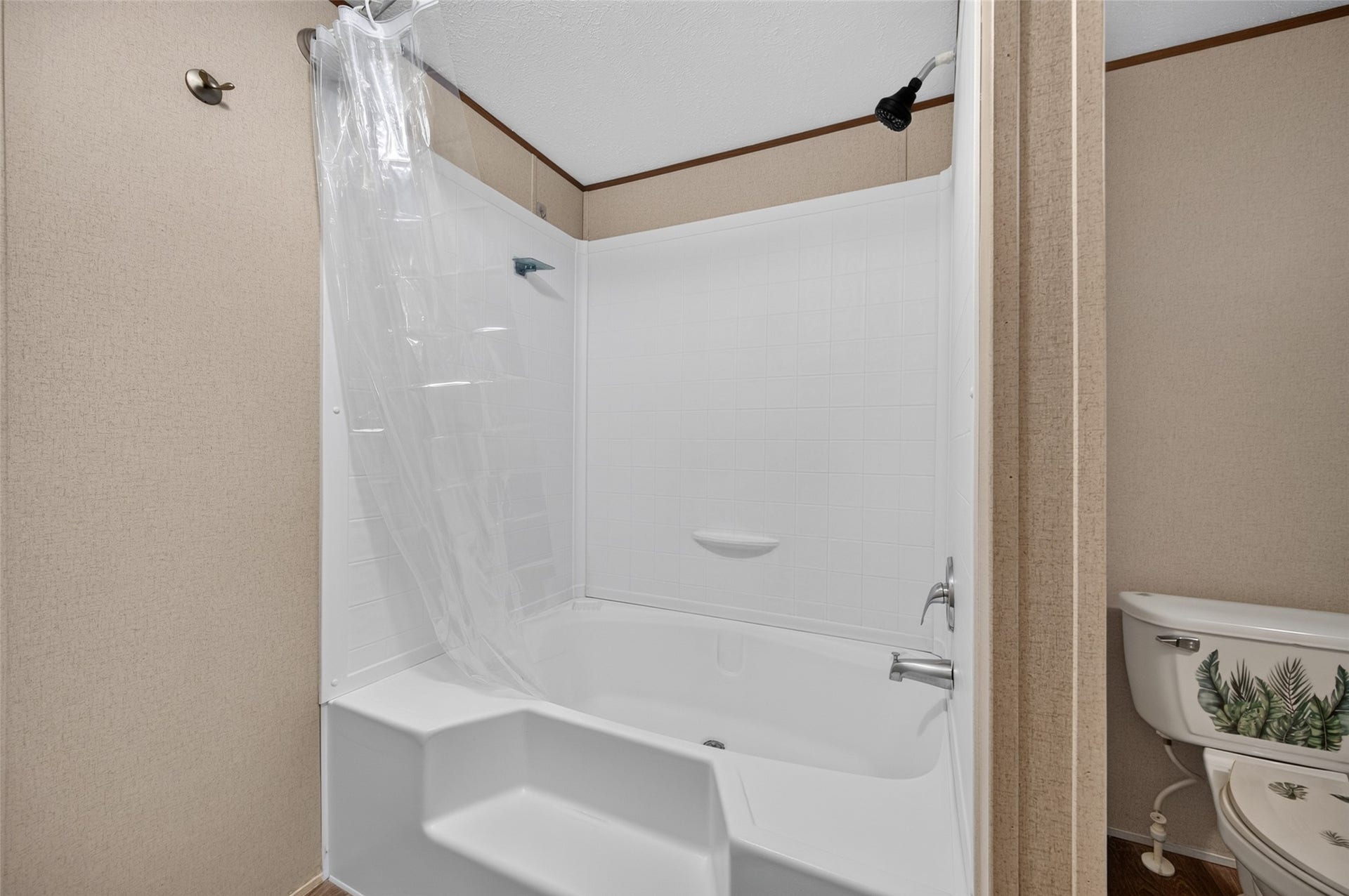 Bathroom features a walk-in shower and tub combo