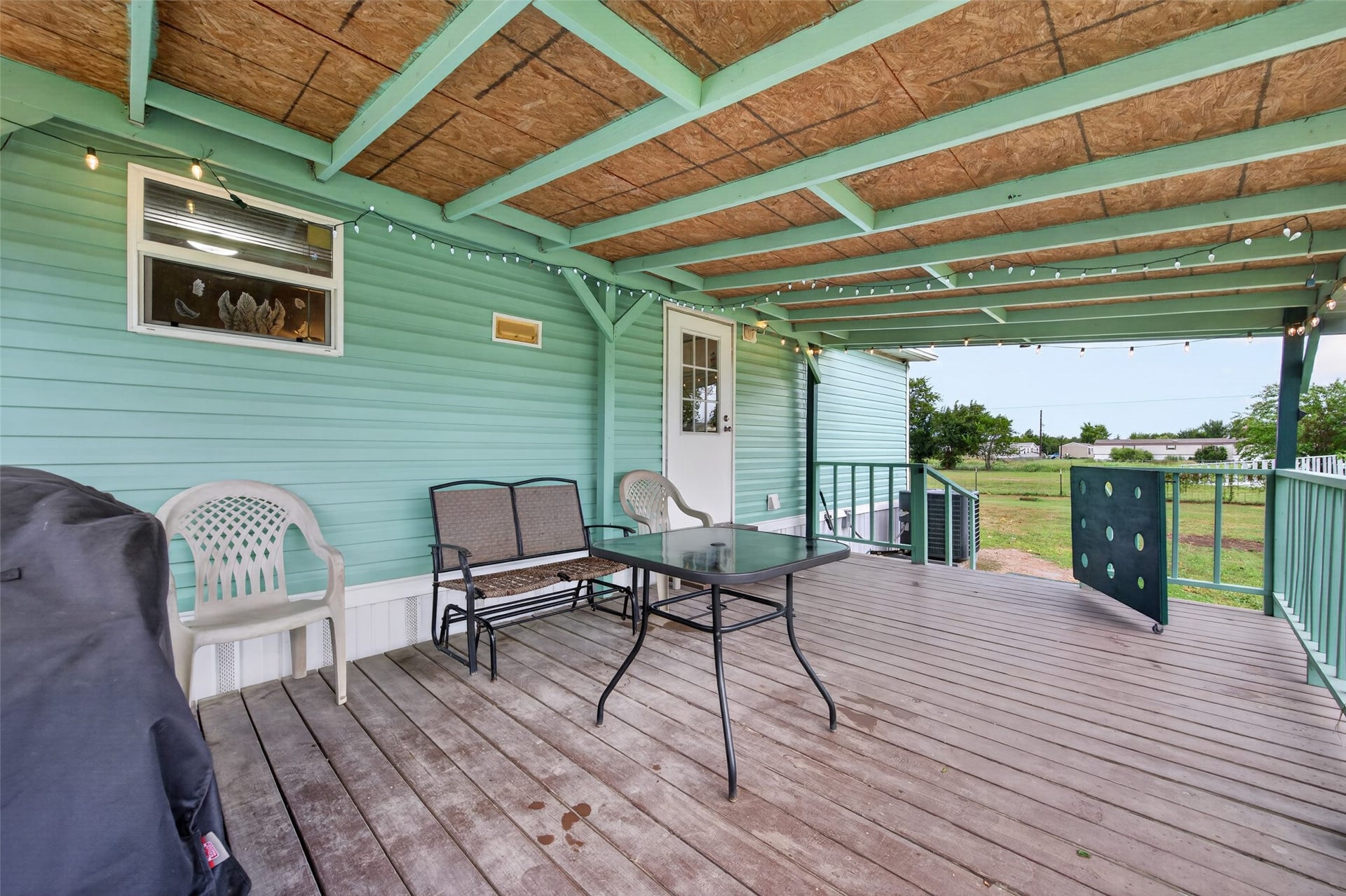 Covered deck seating area, an inviting spot to relax outdoors