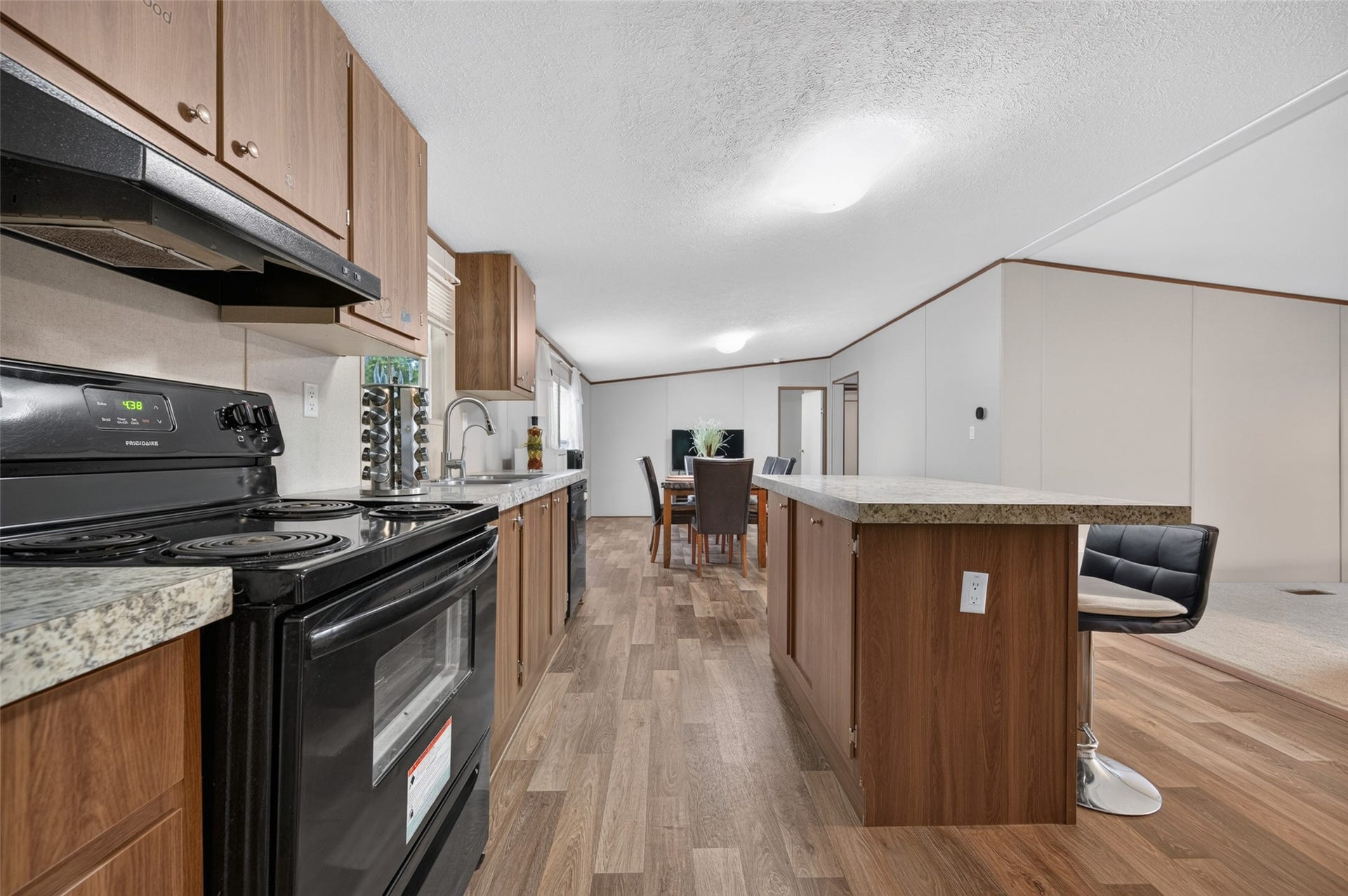 Full view of the galley-style kitchen with plenty of cabinet and counter space