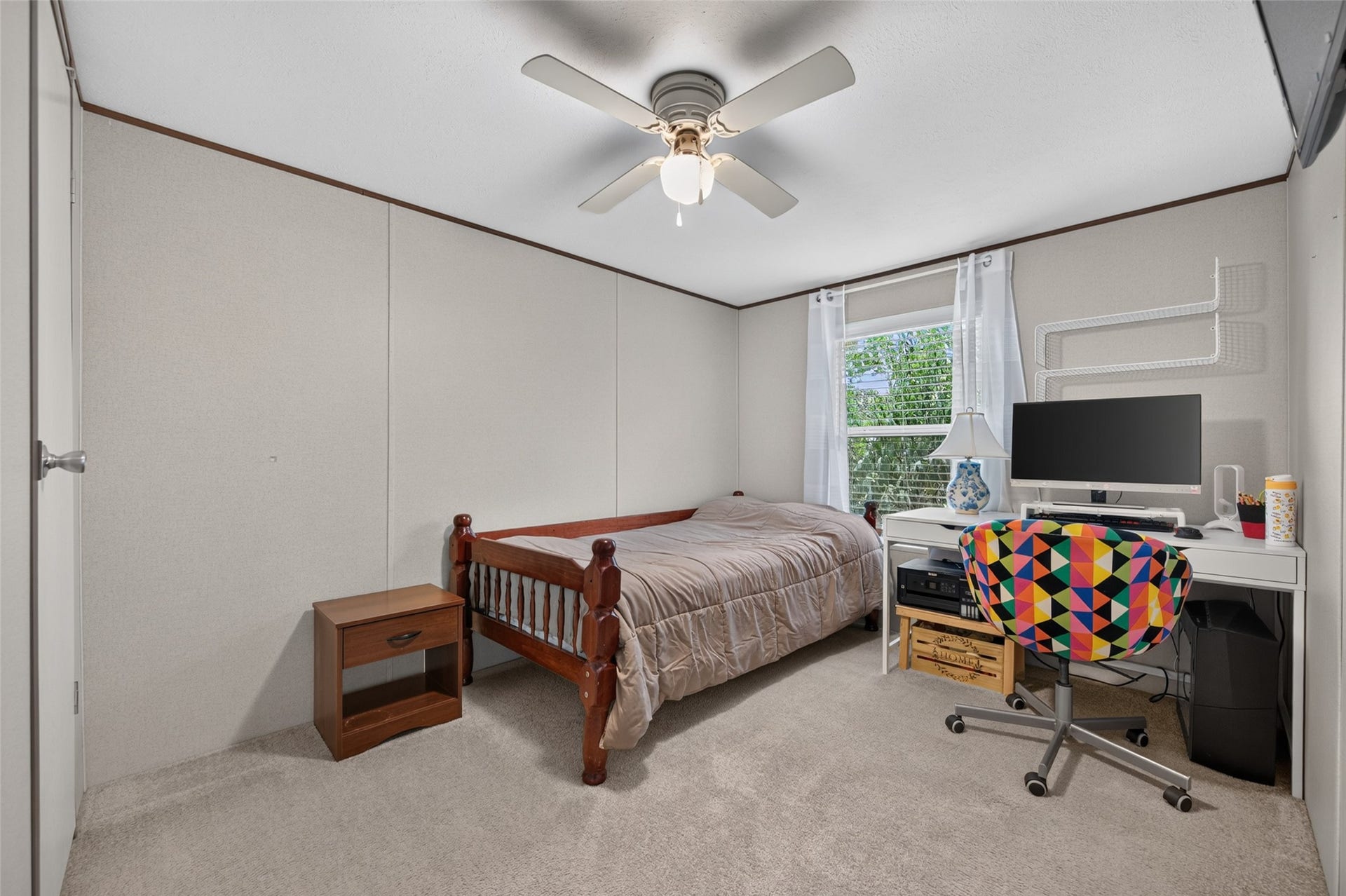 Fourth bedroom with accent wall, ready for your entertainment setup