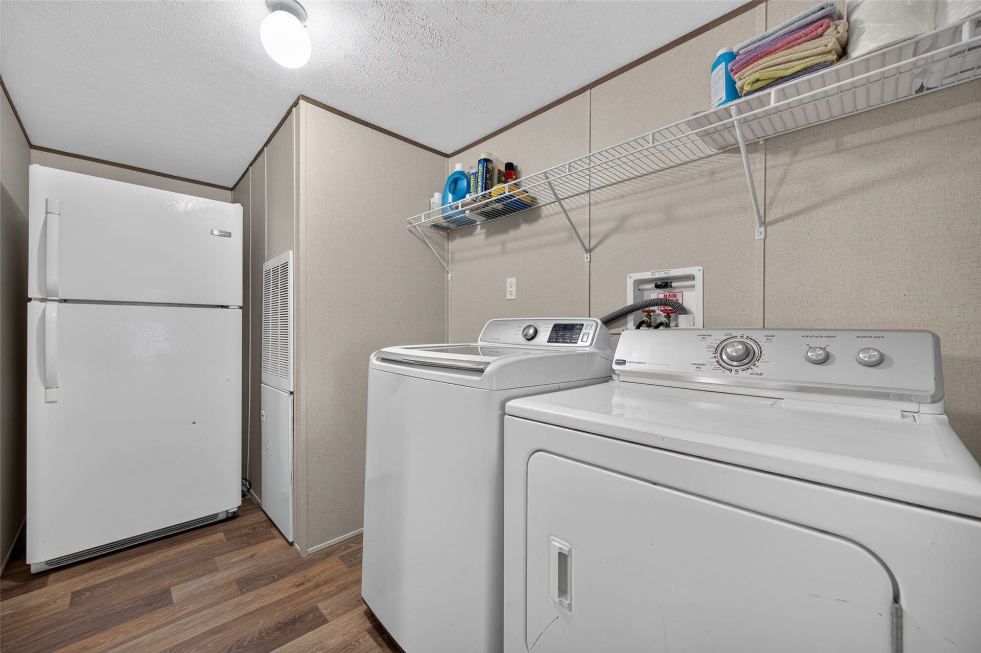 Dedicated laundry room with space for a full-size washer and dryer