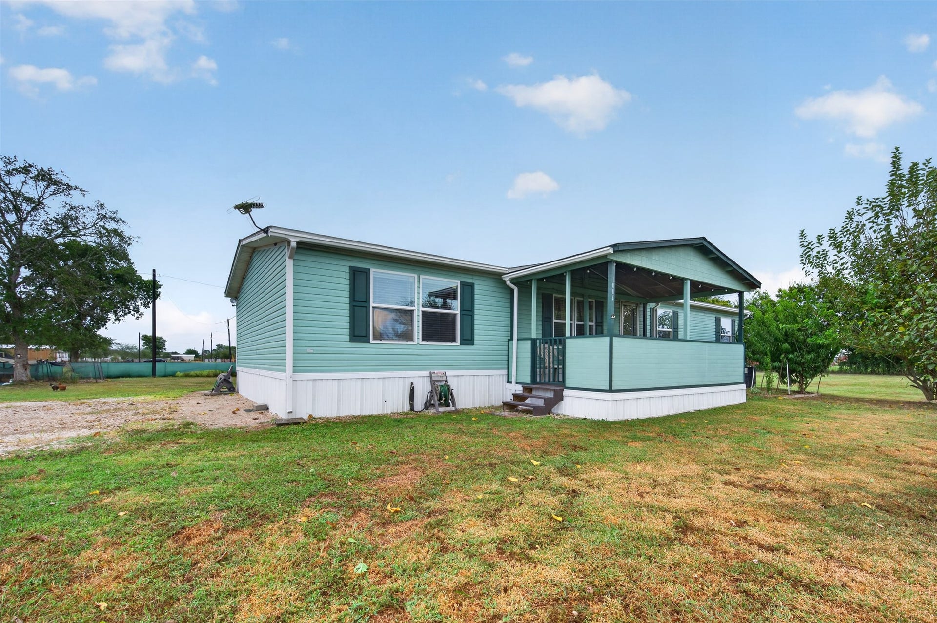 Charming curb appeal with a covered front porch, ready to welcome you home