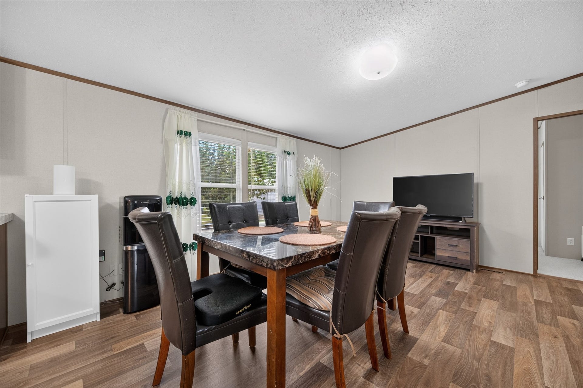 Dining area with room for a large table, just steps from the kitchen