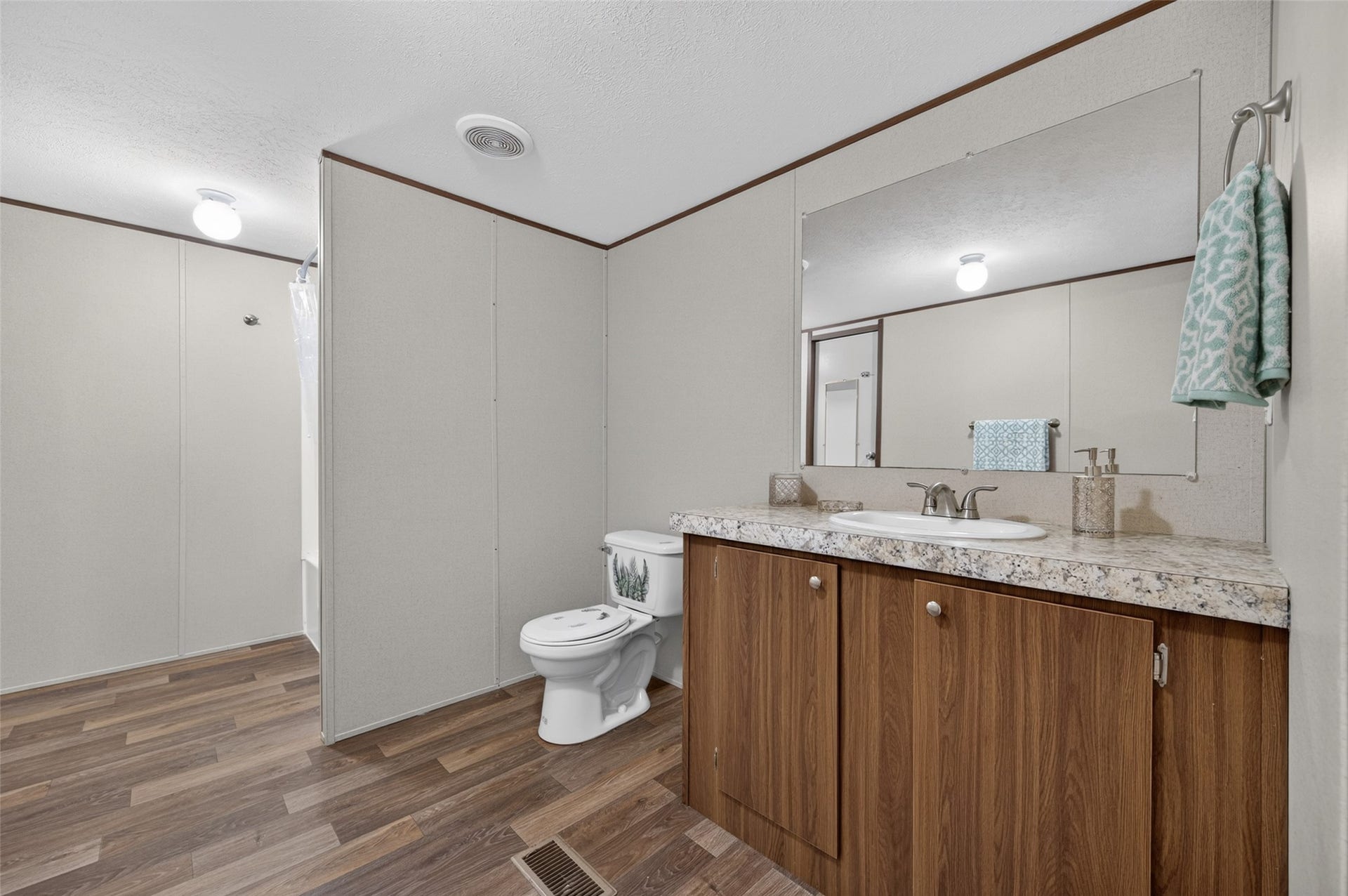 Full bathroom with vanity storage and updated fixtures