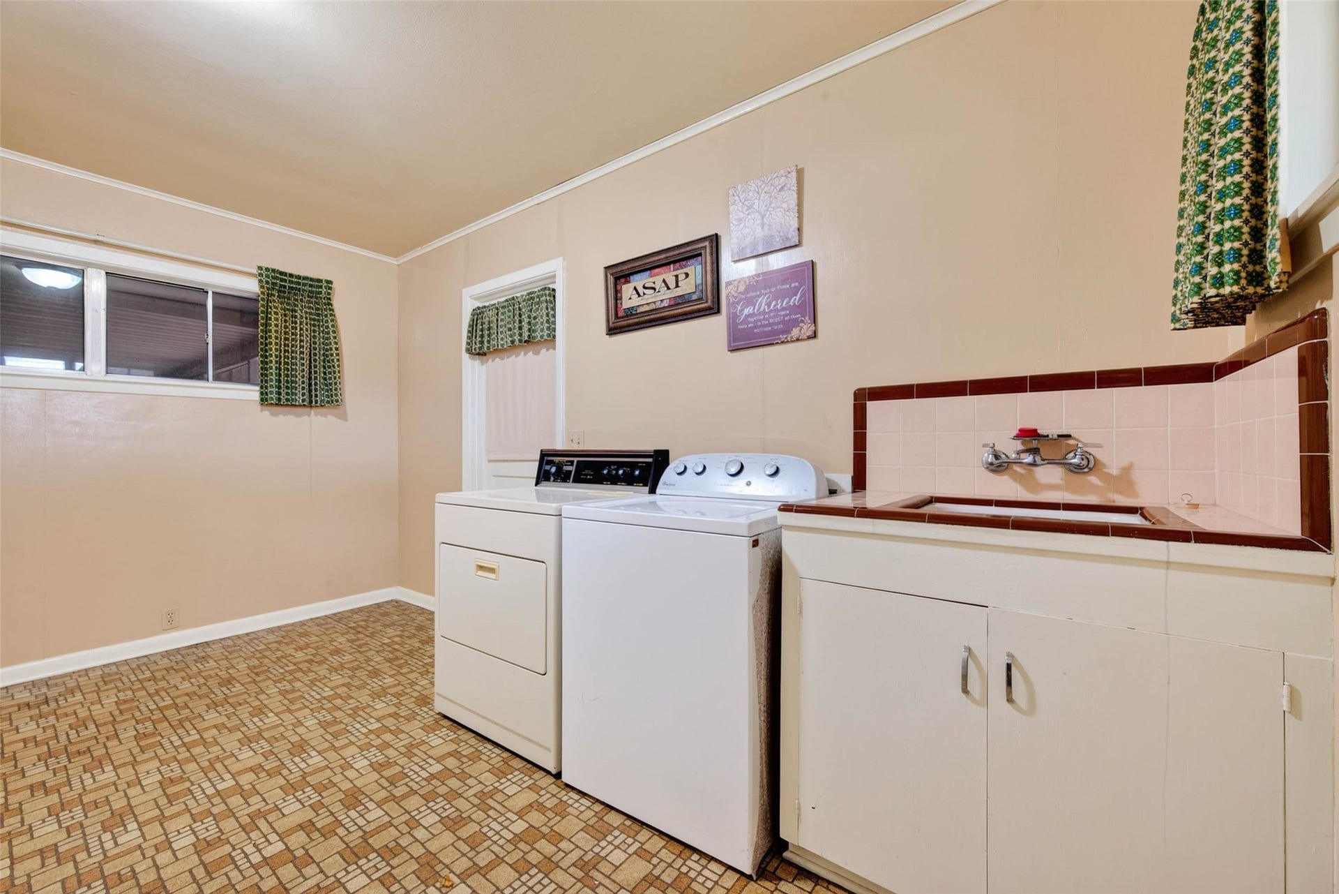 Laundry room is very spacious and leads to the garage