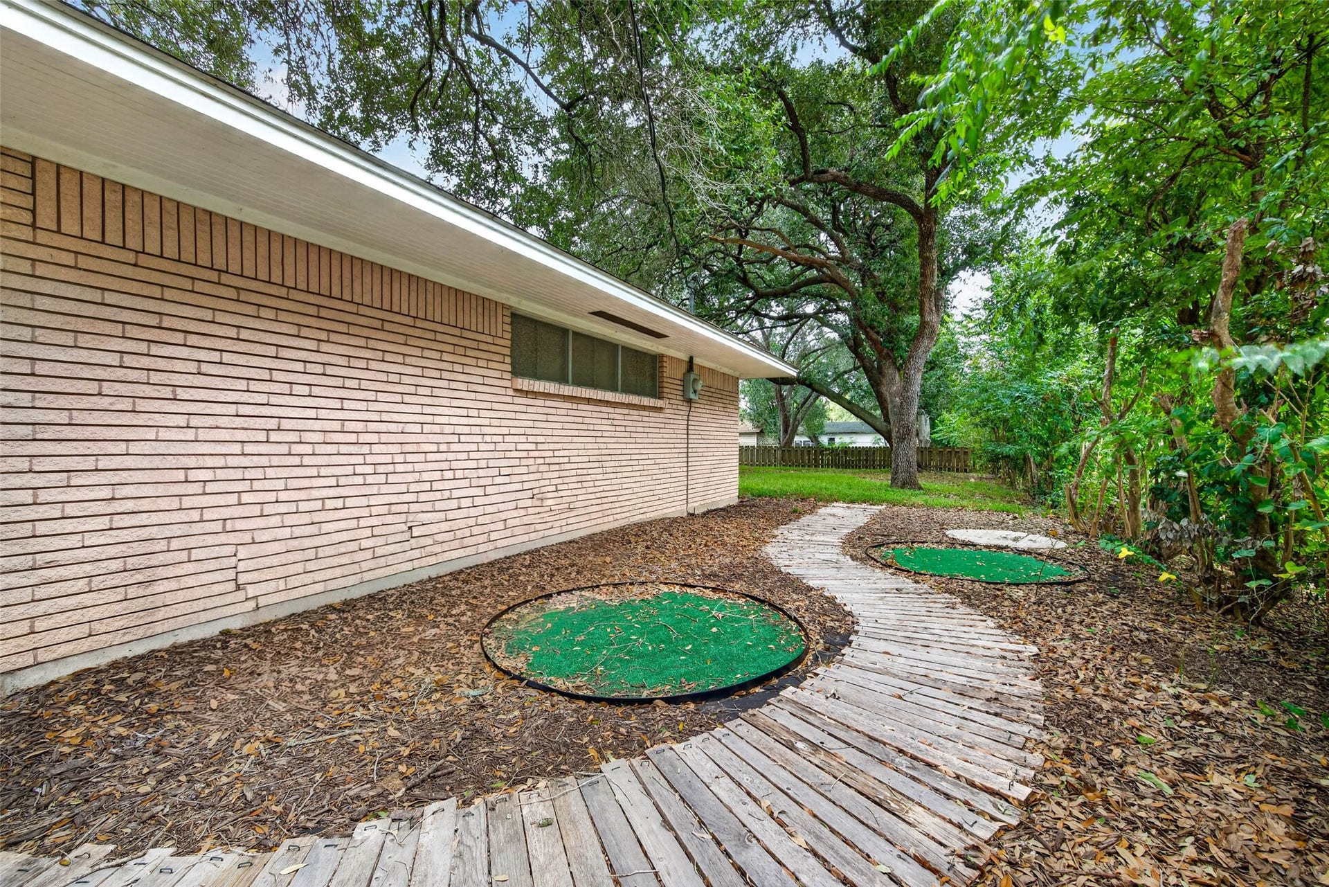 Walkway on the side of the home leading to the backyard