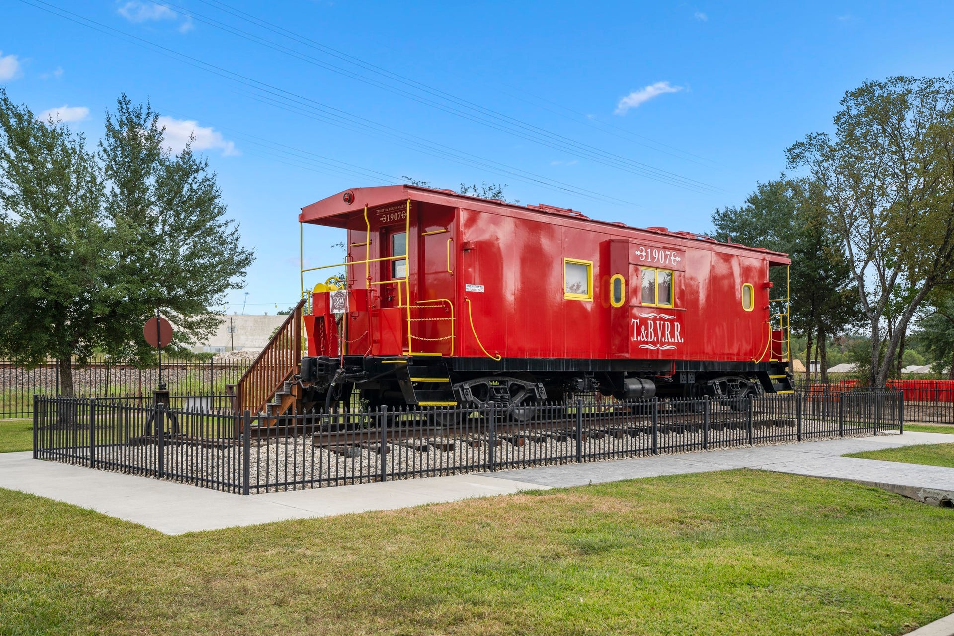 306 Foster Street, Tomball, TX 77375 Here is a wonderful view of the bright red train car at the 1907 Depot Museum.