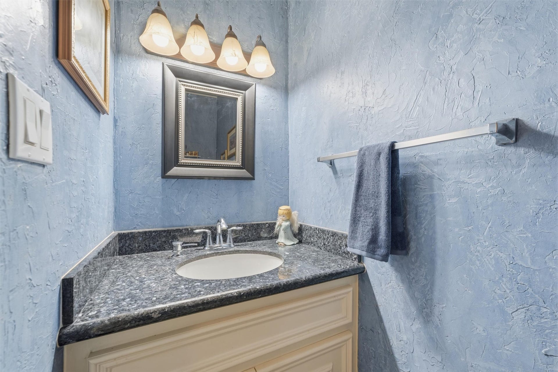 Conveniently located down the stairs from upstairs game room.