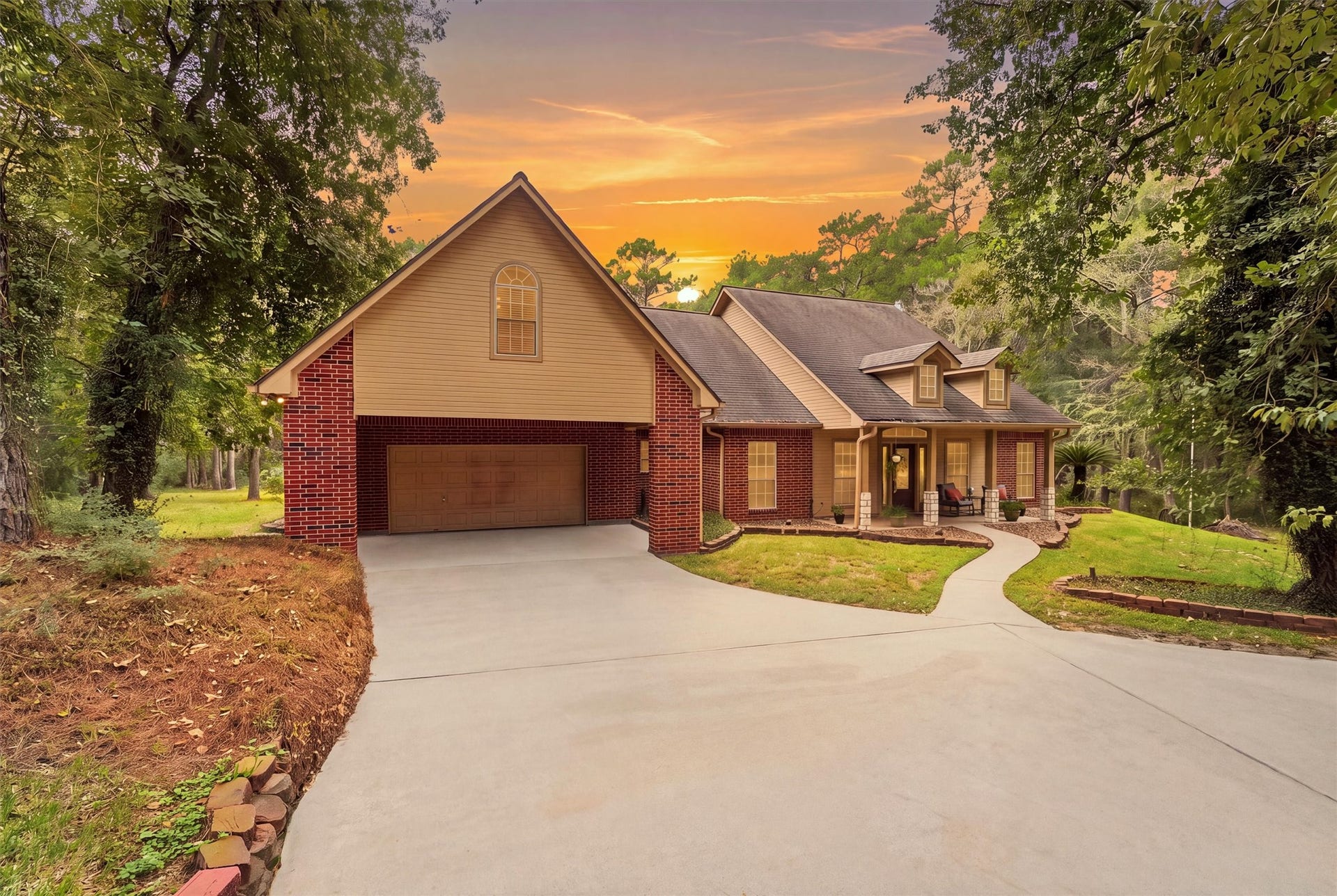 The home sits in a serene wooded setting on 4 landscaped lawn