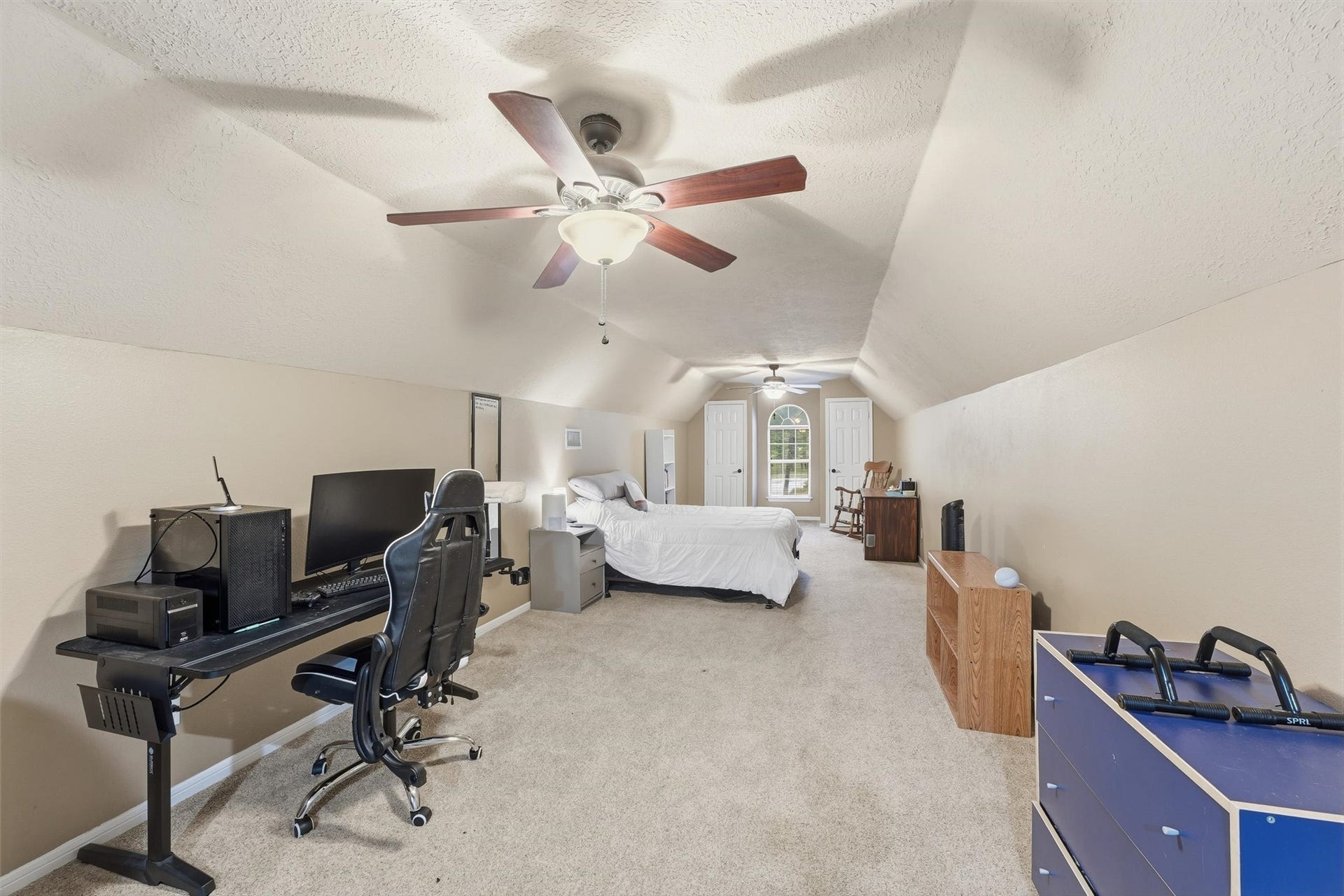 Oversized upstairs game room offers a cozy, inviting retreat with plenty of flexibility. As pictured, the versatile space can also serve as an additional bedroom, guest retreat, or entertainment area.