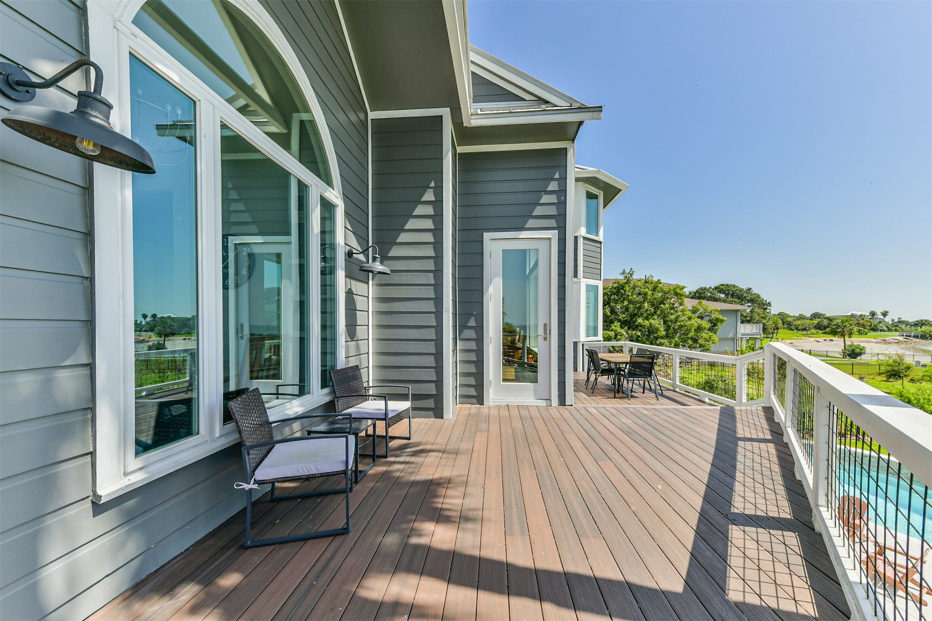 Deck with stylish outdoor seating, perfect for enjoying panoramic views and al fresco dining.