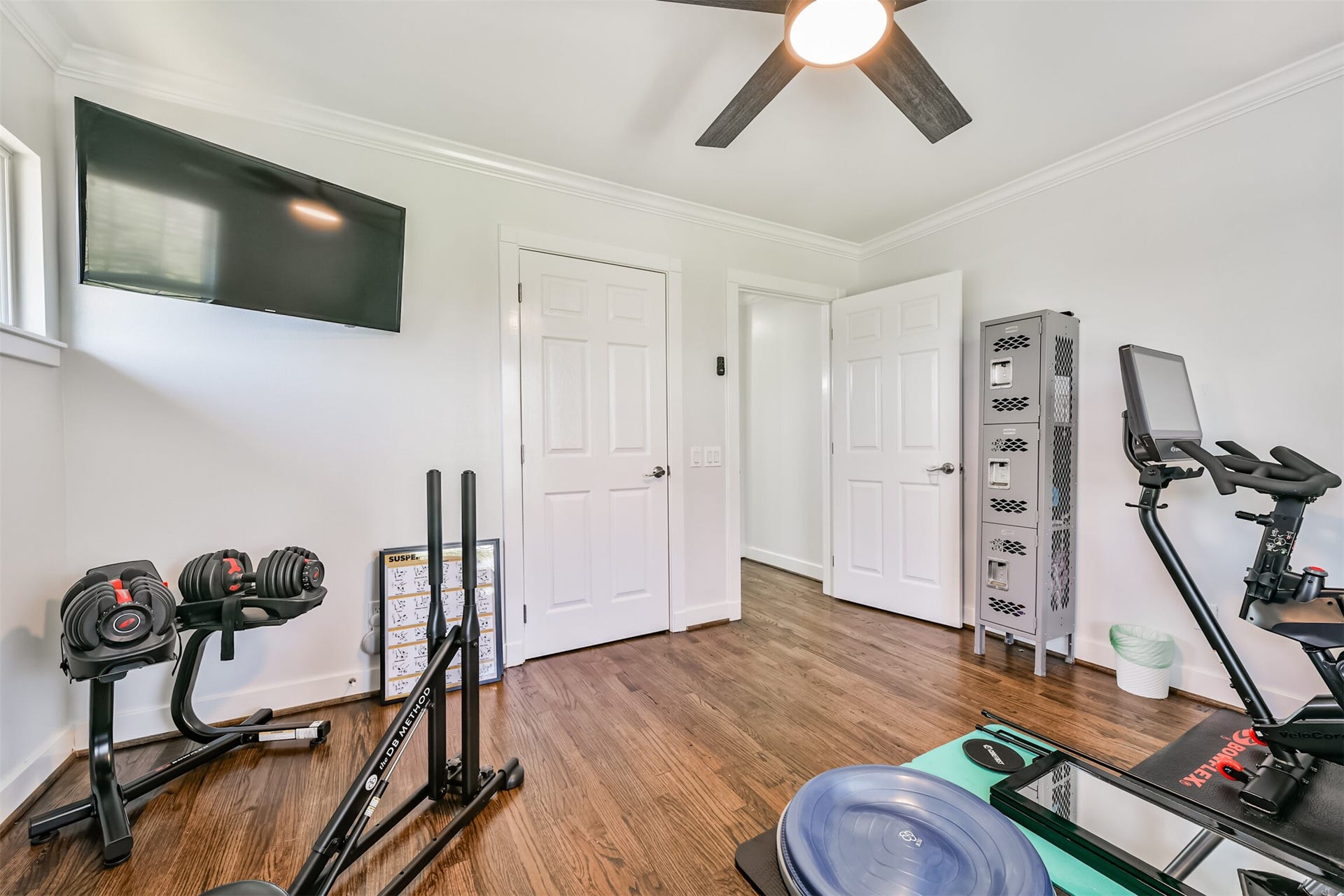 Functional room or office space with a built in ceiling fan for added comfort.
