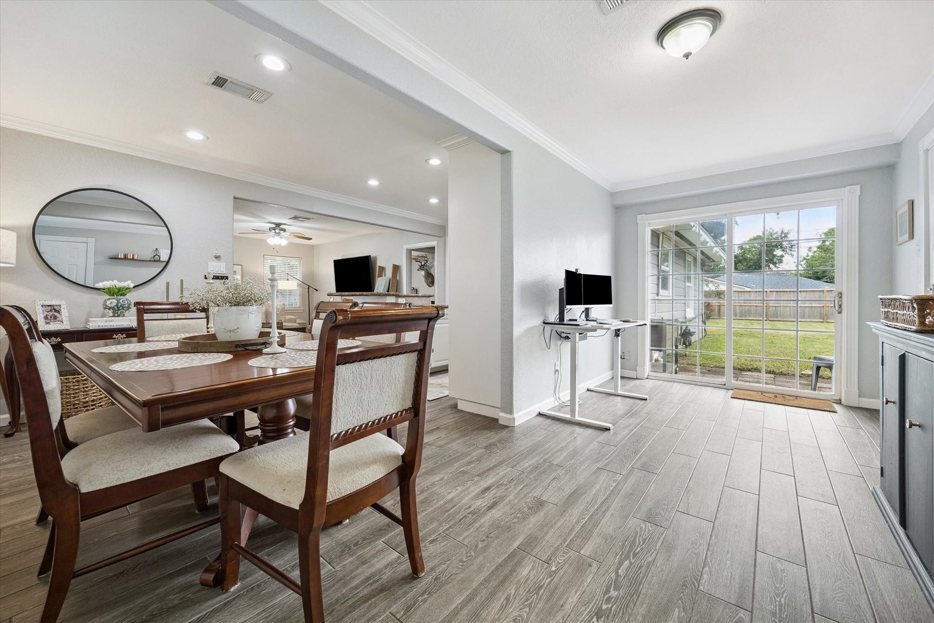 The open concept layout connects the dining area and flex room, creating an adaptable space ideal for both daily living and entertaining.