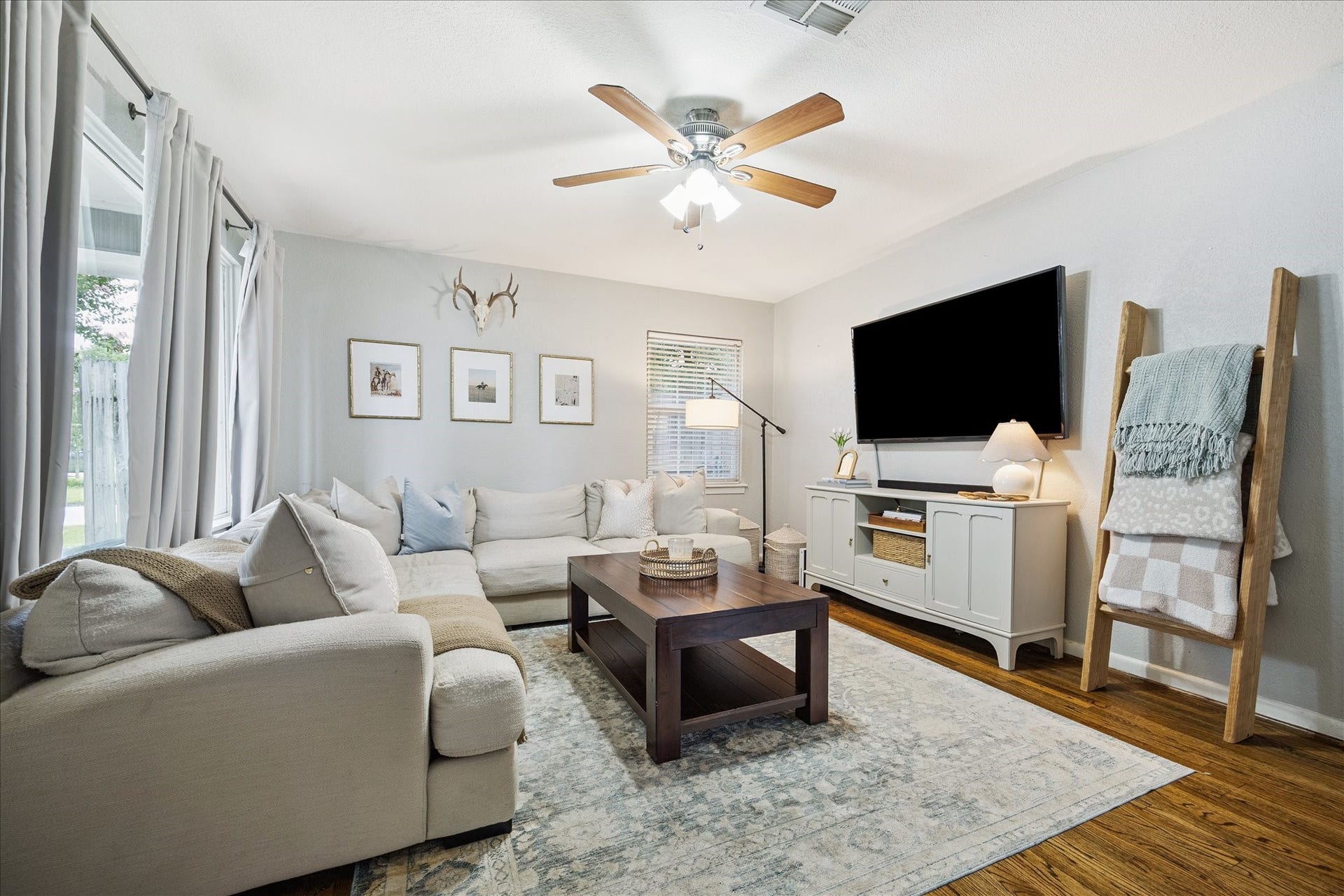 The living room shows the homes generous proportions and natural light, perfect for relaxing or hosting guests.