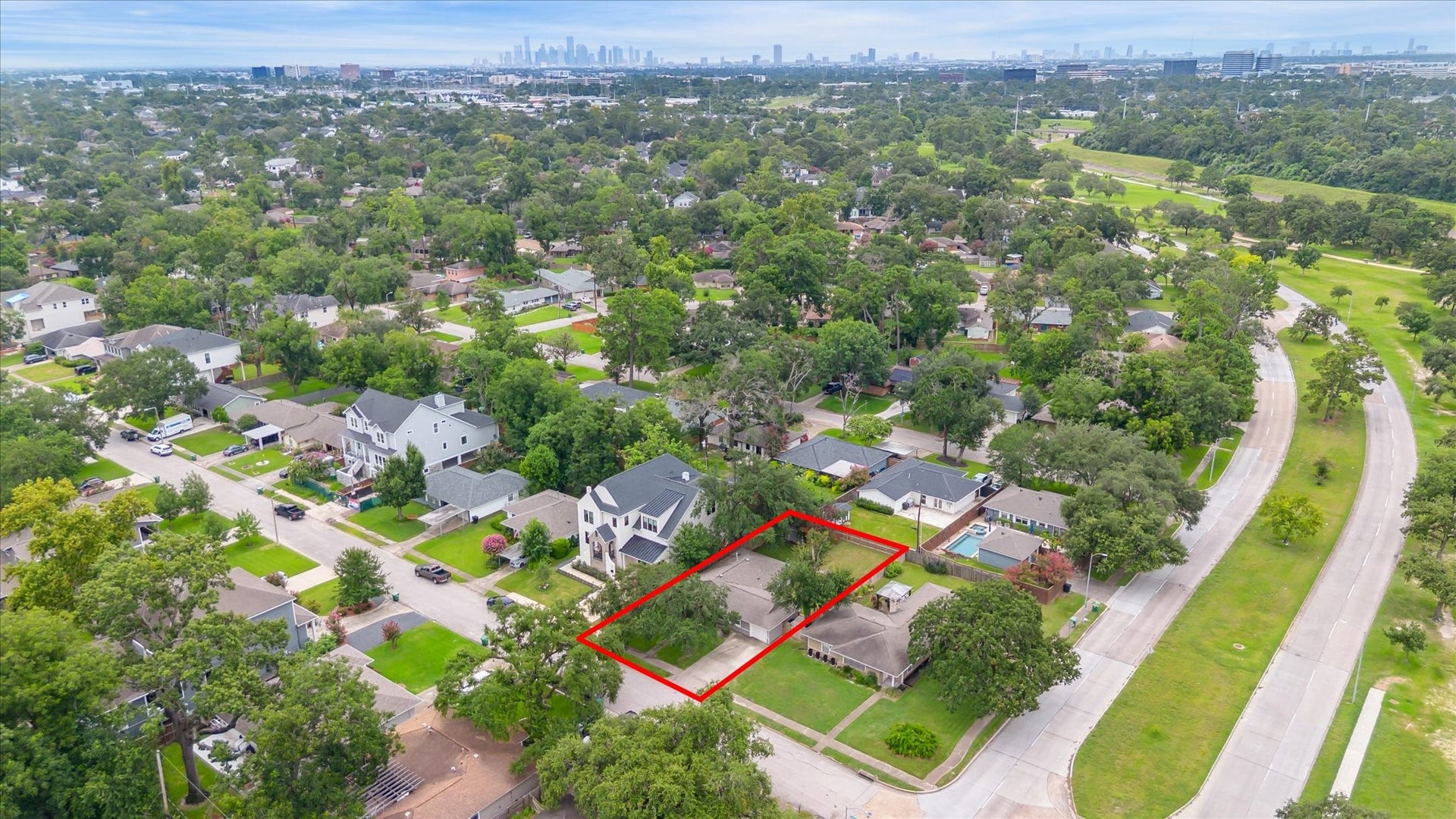 Sweeping view of the tree-lined Oak Forest neighborhood shows proximity to major amenities, with easy access to the Heights, Galleria, and Downtown.