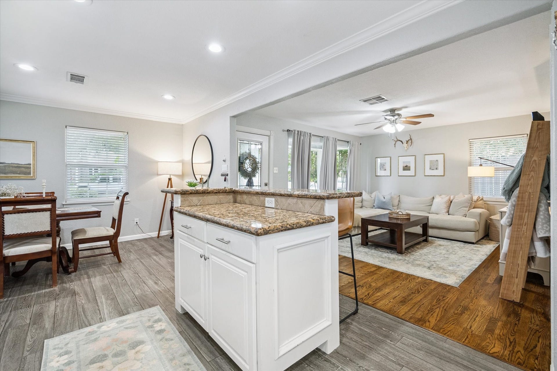 An additional view of the kitchen highlights the open-concept layout, connecting directly to both the living and dining spaces.
