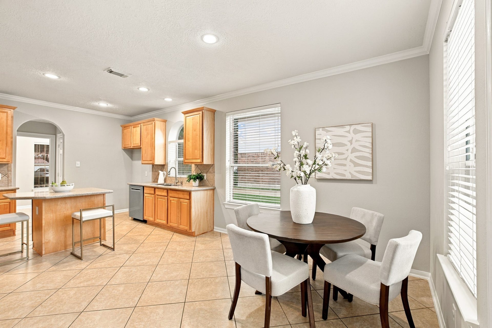 Bright breakfast area with abundant natural light and easy access to the kitchen and breakfast bar.