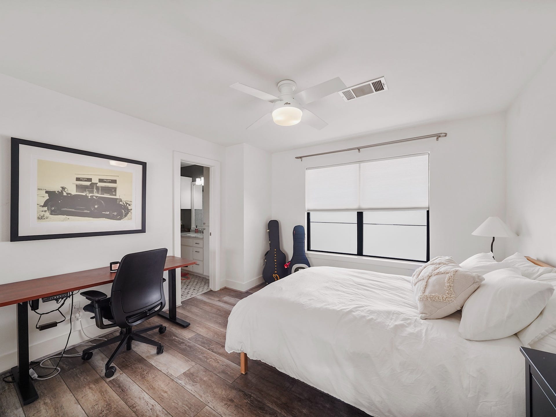 1231 Jackson Boulevard, Houston, TX 77006 This bright and spacious secondary bedroom, complete with an attached bath, offers comfort and style for a perfect retreat.