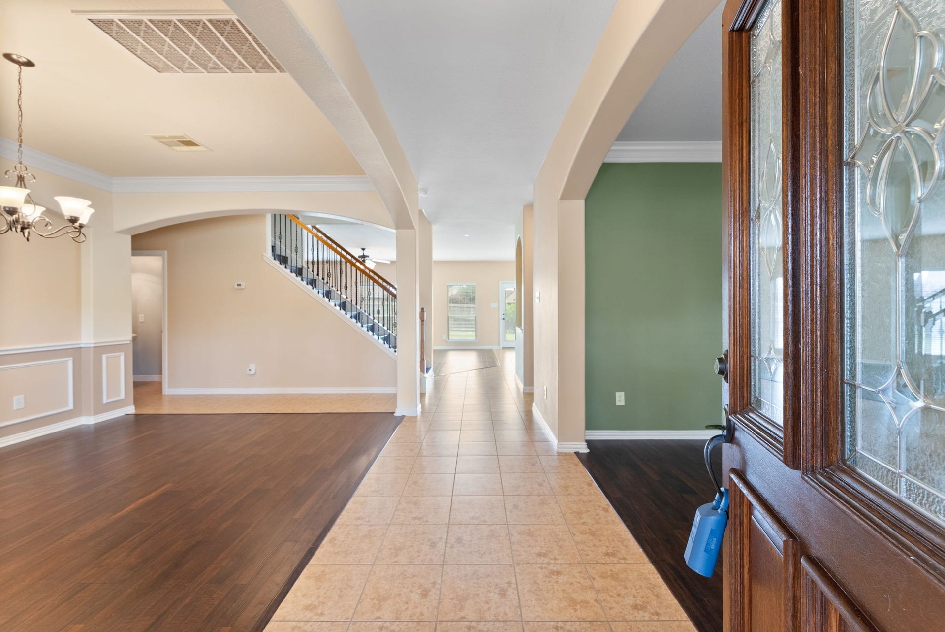 19415 Sorrell Ridge Drive, Spring, TX 77388 Bright and airy open floorplan with dining on the left, study on the right, and family and kitchen overlooking the backyard.
