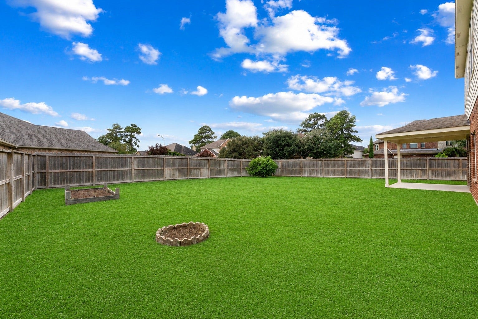 19415 Sorrell Ridge Drive, Spring, TX 77388 Yard is complete with growing beds for your favorite veggies or flowers.