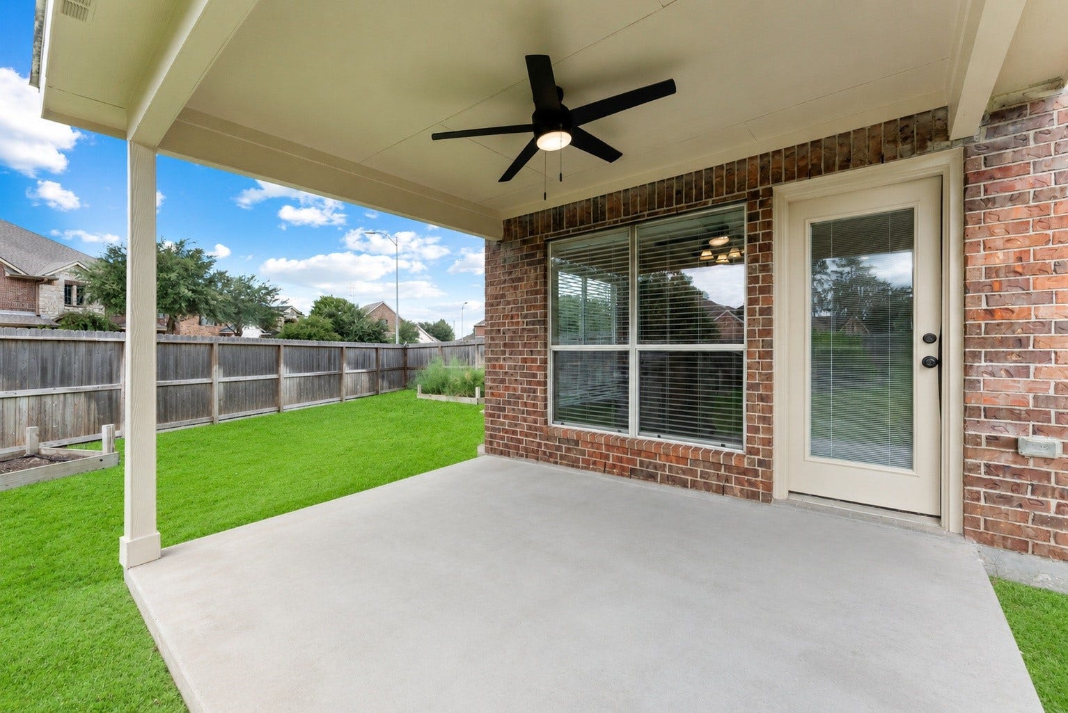 19415 Sorrell Ridge Drive, Spring, TX 77388 Covered back porch with large ceiling fan to keep things cool while enjoying the outdoors.