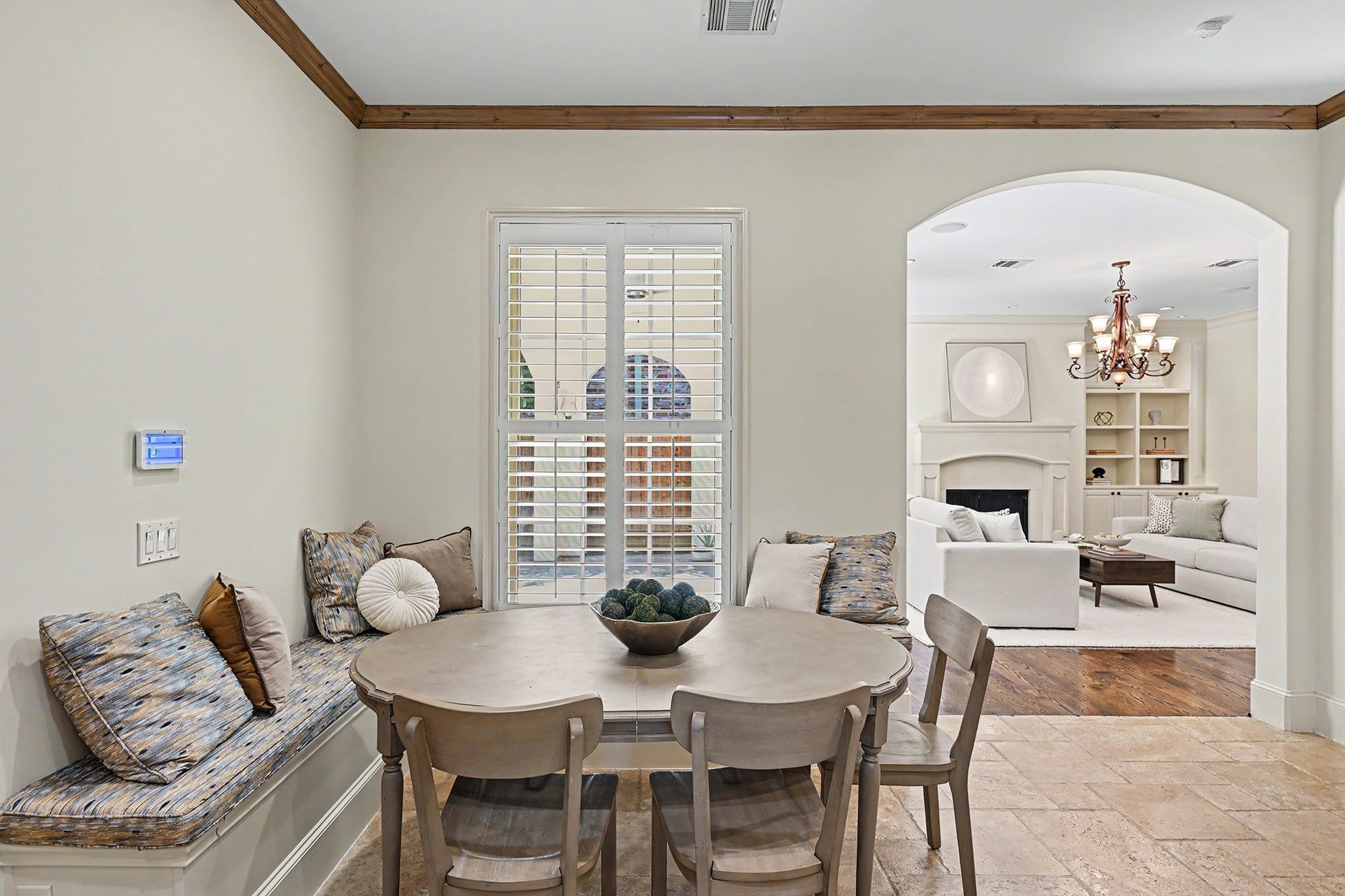Breakfast room with built-in bench is open to the kitchen and great for casual meals.