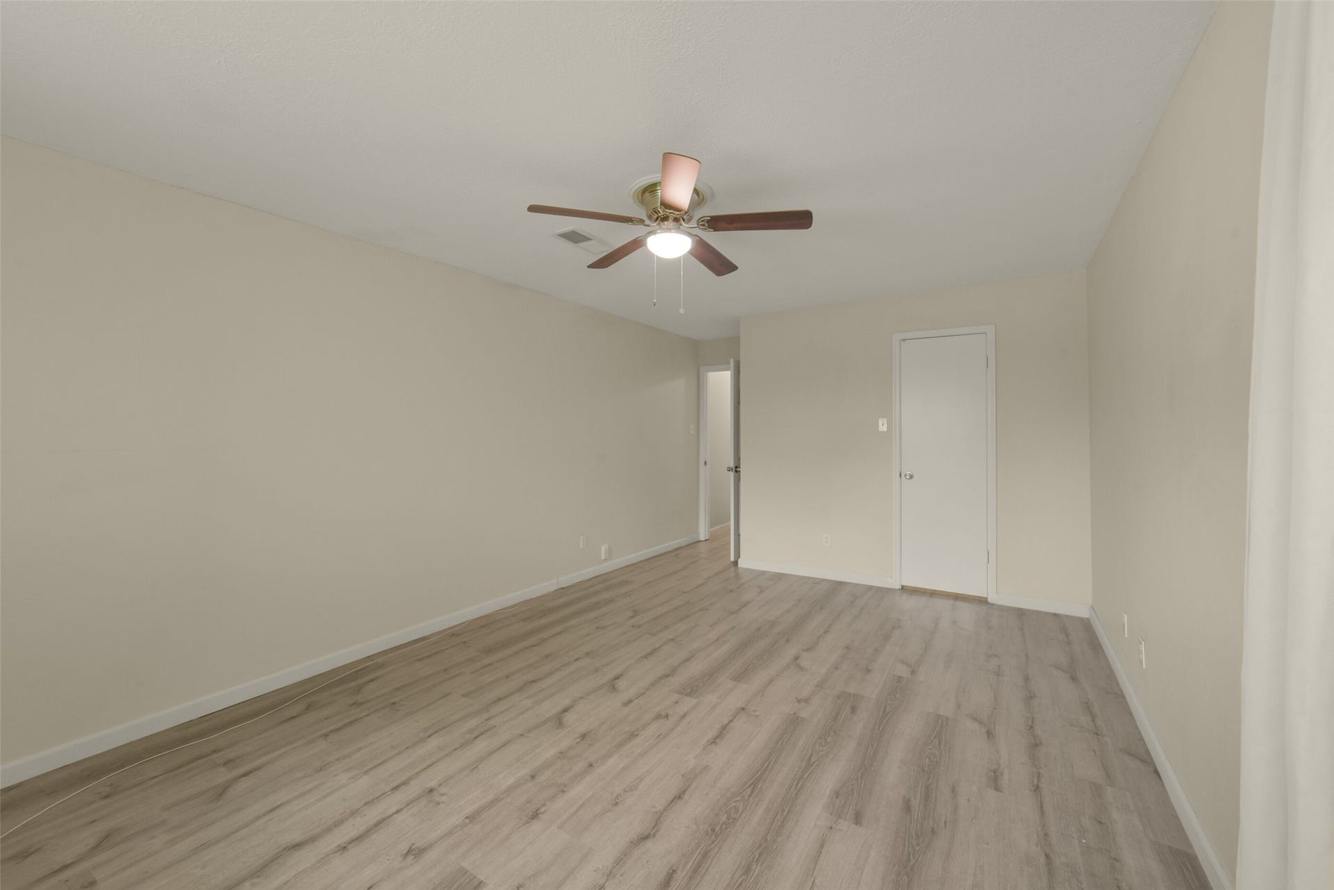 Alternate view of the spacious primary, a comfortable and private retreat within the home.