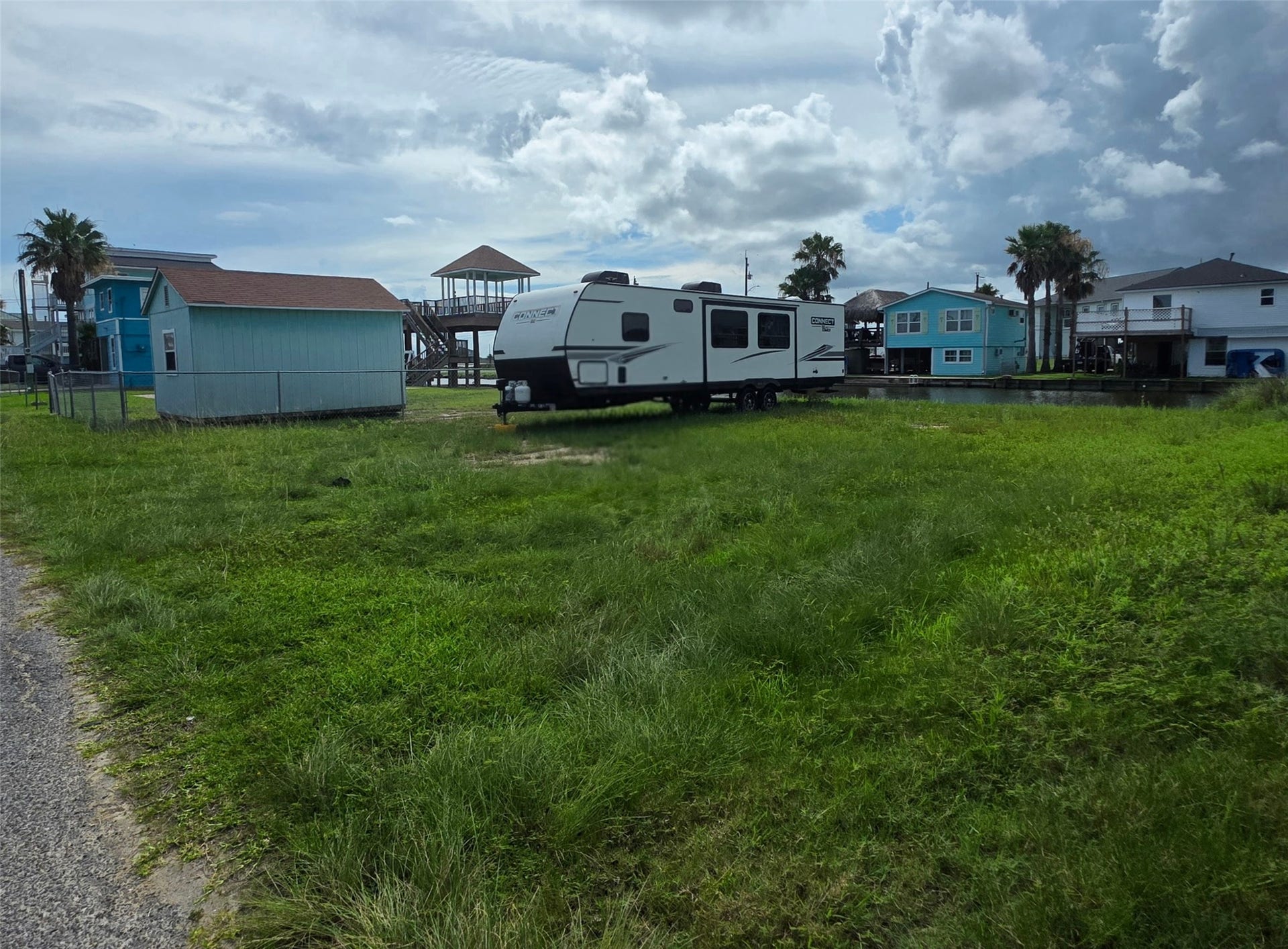 Wide lot with excellent waterfront access and endless possibilities to design and build your dream home by the water.