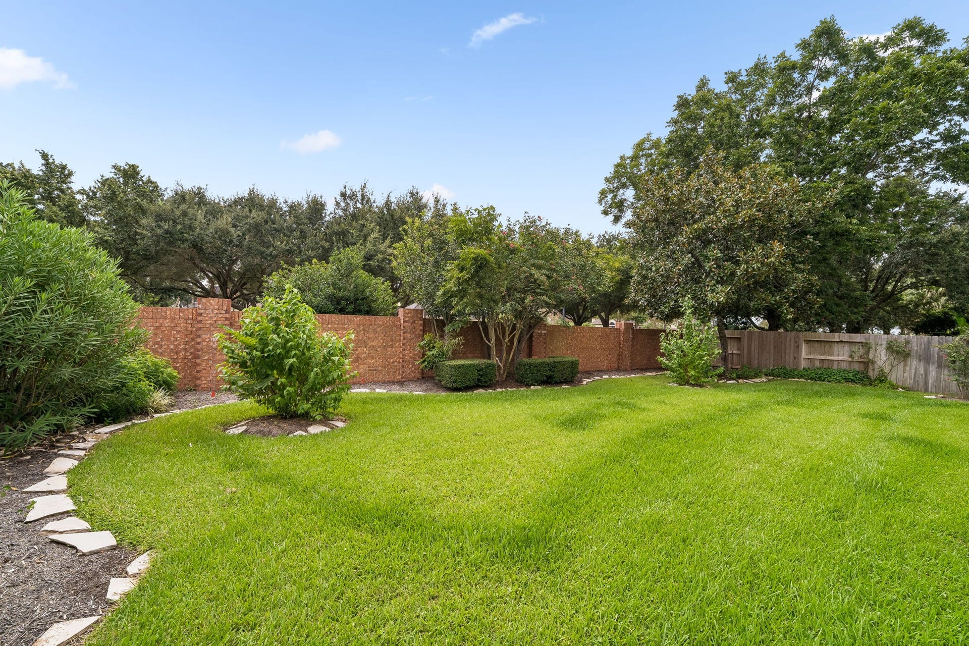 Lush green lawn, perfect for family living.
