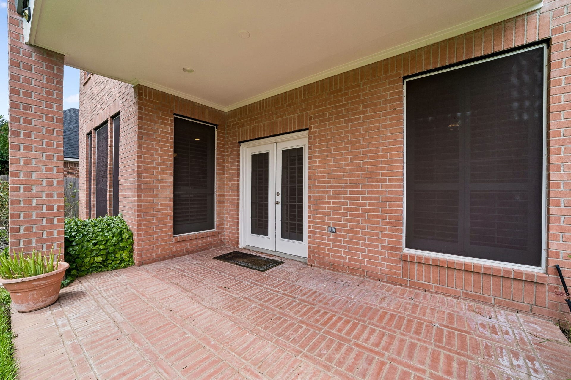 Charming covered patio perfect for relaxation and outdoor entertaining.