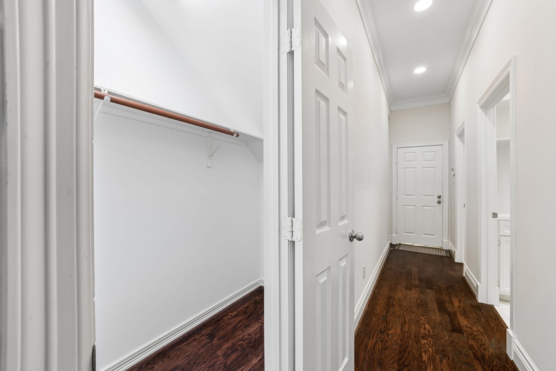 Under the stair Storage closet on the left. The walk way on the right leads to the laundry room, a bathroom and the garage door.